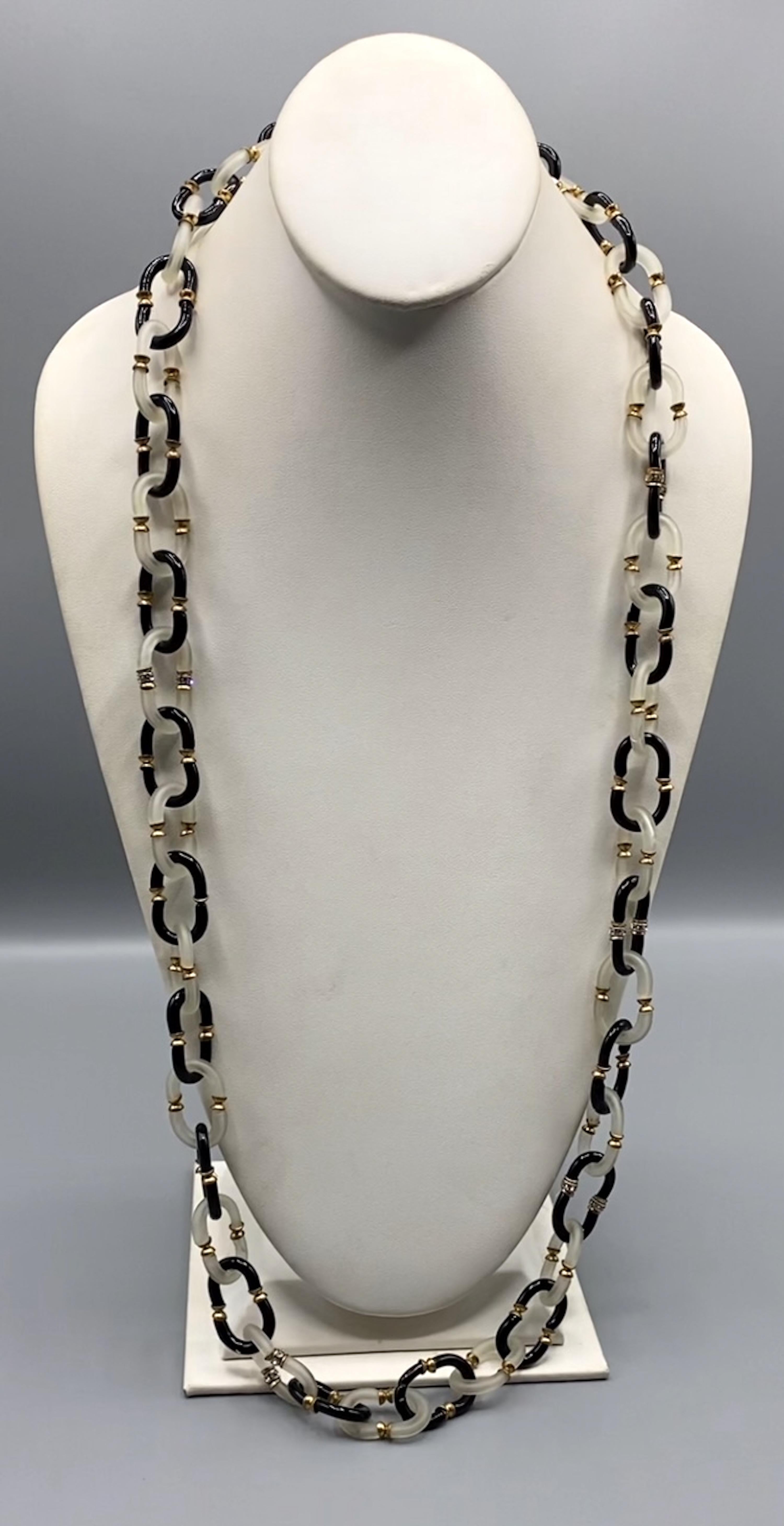 Lovely glass chain necklace by Archimede Seguso of Italy. Chain links are hand formed of two C shape glass pieces. The necklace is 37 inches long and .75 of an inch wide.
Gold Clasp with Logo AS for 
