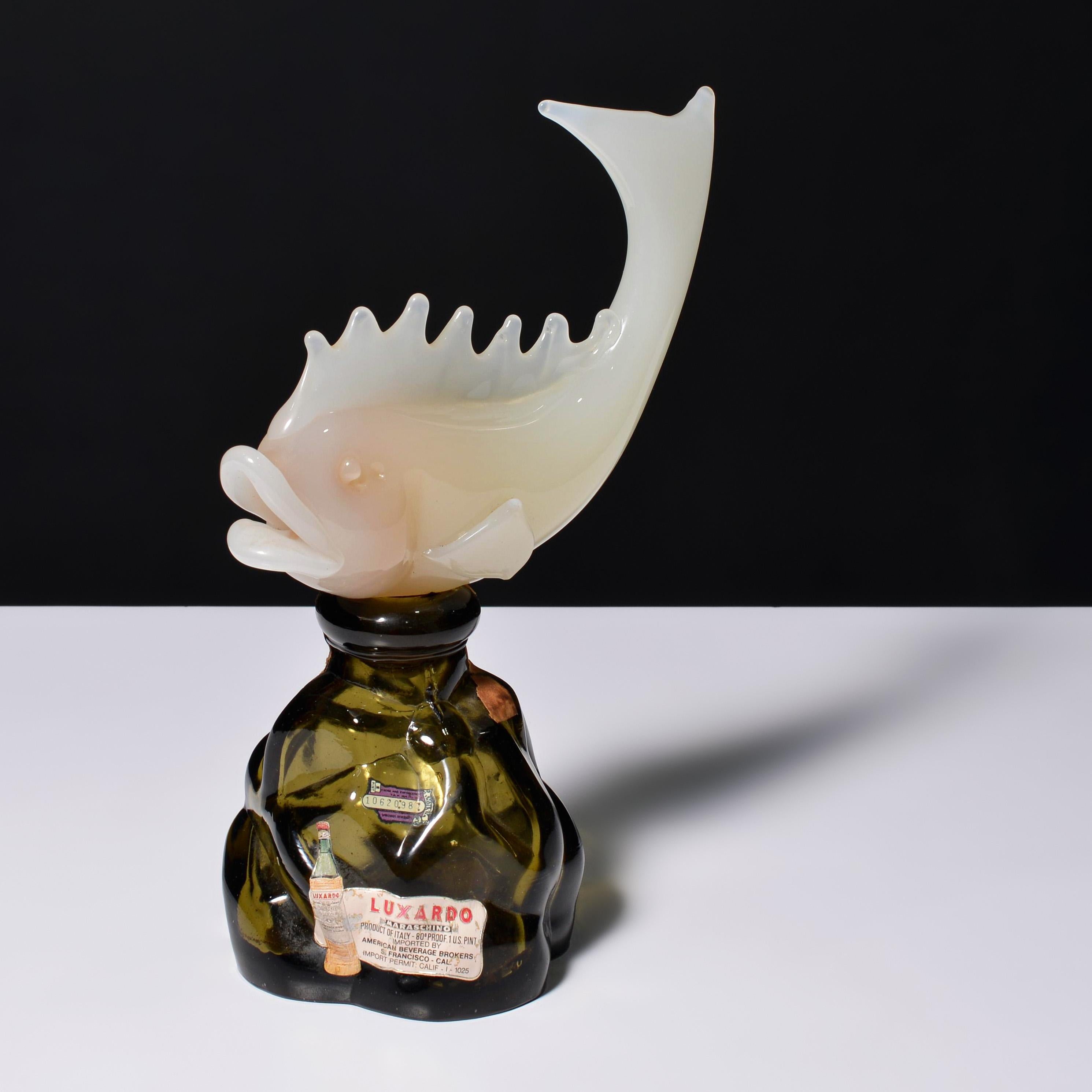 Artista/Designer; Produttore: Archimede Seguso (italiano, 1909-1999)
Marcatura(e); note: Etichetta Luxardo, etichette, marcatura/e
Materiali: vetro
Dimensioni (H, L, P): 12 