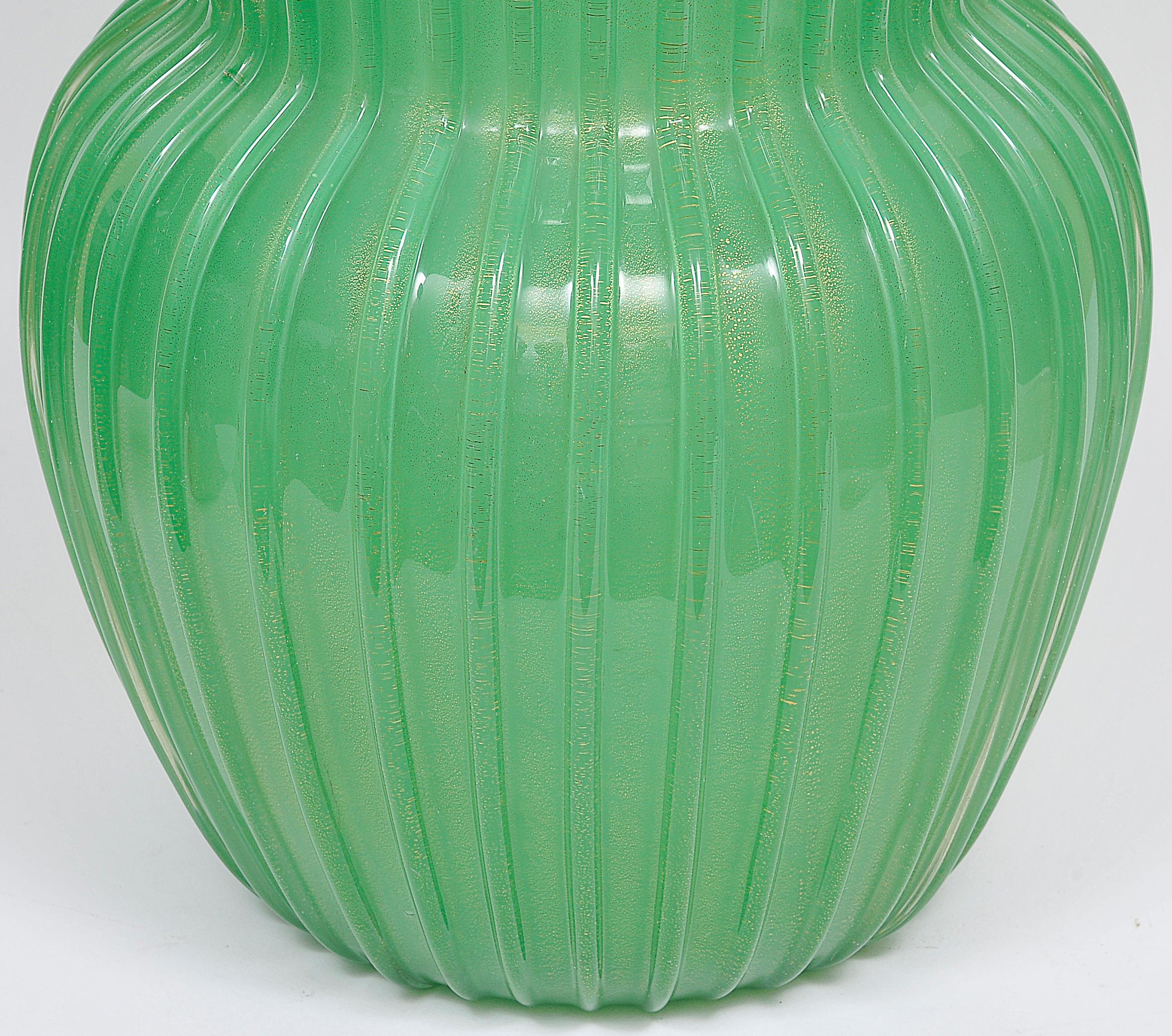 Big and bulky vase with vertical ribs in green Murano glass and gold leaf. Museum quality.