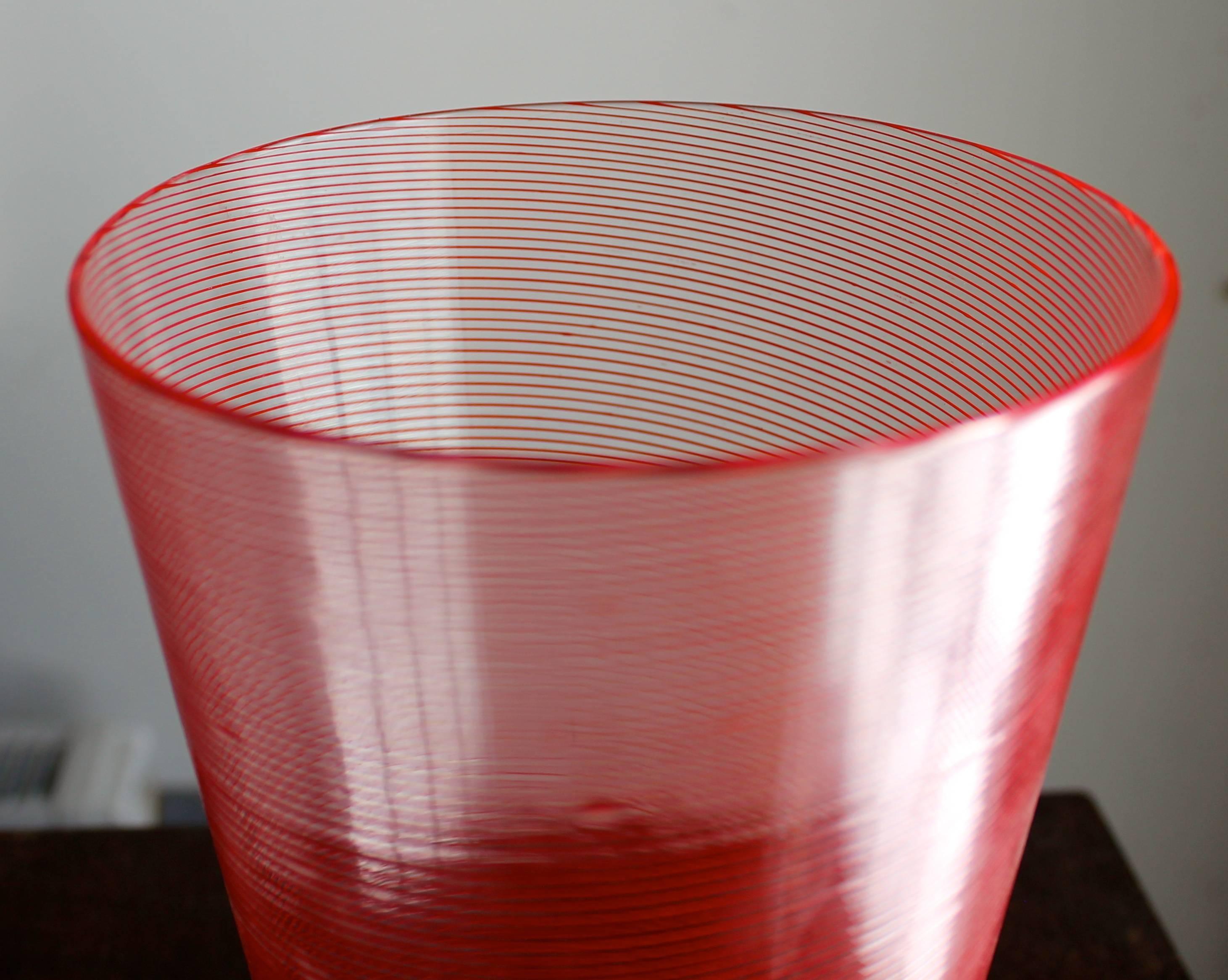 Very fine red glass thread on clear round truncated soffiati. Unsigned, (missing the usual paper label).