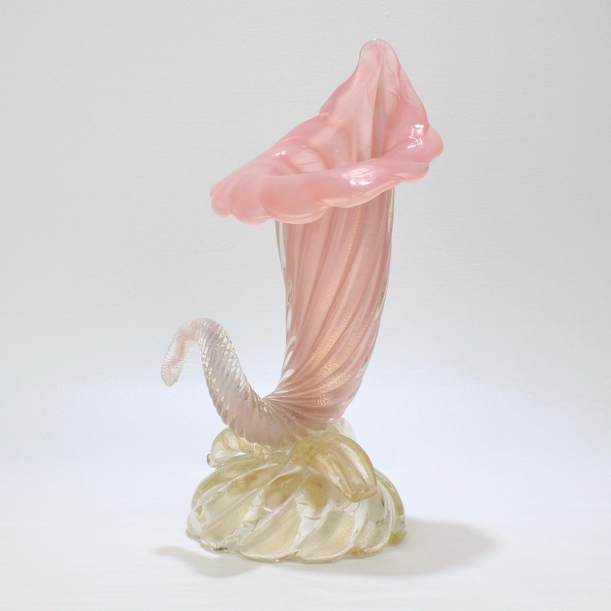 A very fine Mid-Century Modern Murano glass cornucopia vase by Archimede Seguso.

Made in the 'opalino a coste' technique - with a cornucopia top consisting of pink opalescent glass supported on a clear base with gold inclusions