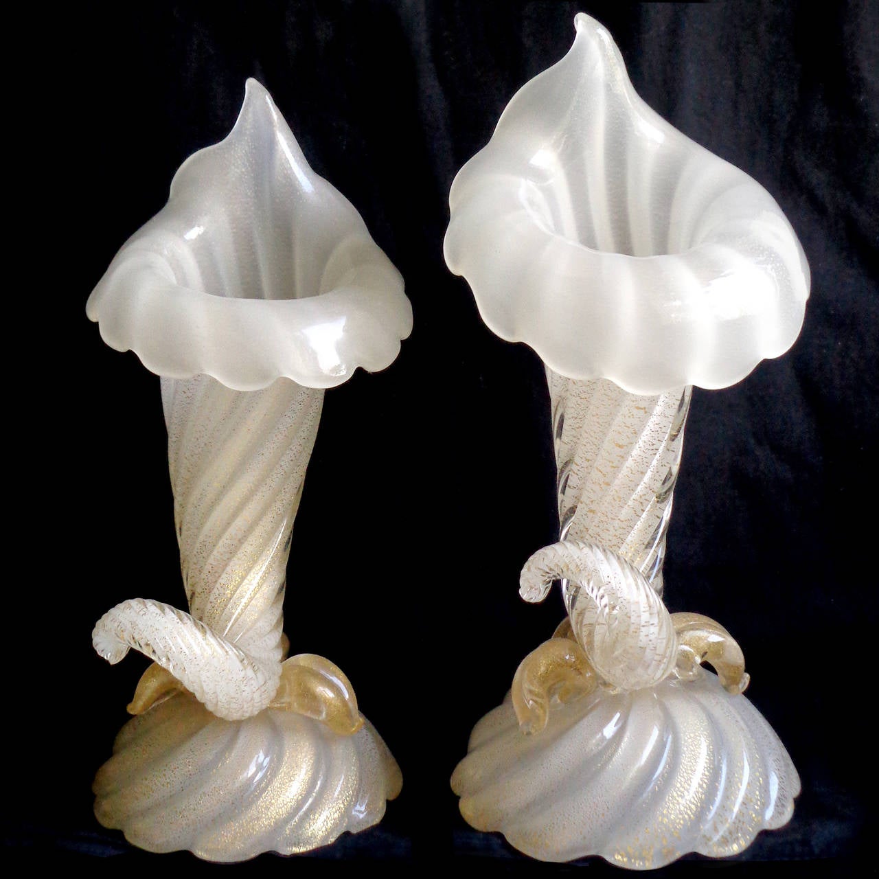 Elegant pair of vintage Murano handblown opal white and gold flecks Italian art glass cornucopia flower vases. Documented to designer Archimede Seguso, circa 1950s, and published in his book. One of them still retains an original 