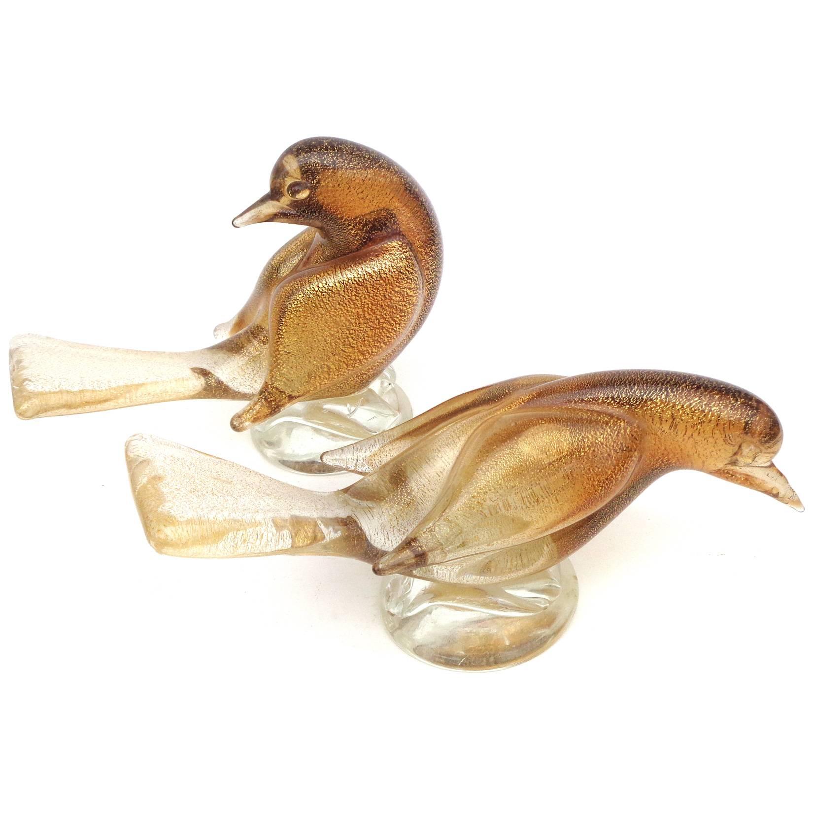 Beautiful set of vintage Murano hand blown Sommerso amber and gold flecks art glass dove bird sculptures / figurines. Documented to designer Archimede Seguso, with original labels underneath. Would make a great display piece on any desk, vanity or