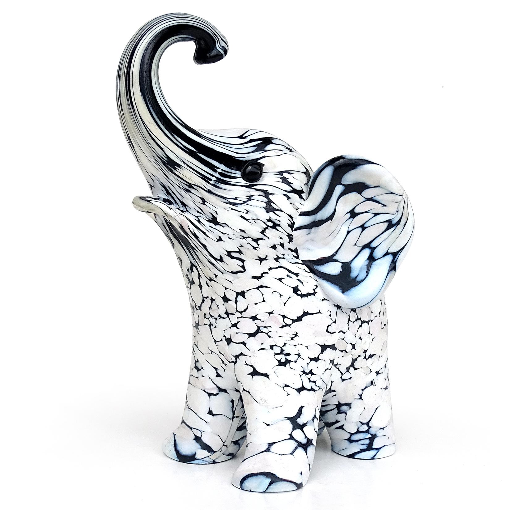 Beautiful, and rare, vintage Murano hand blown black and white spotted Italian art glass elephant sculpture. Documented to designer Archimede Seguso, from the 