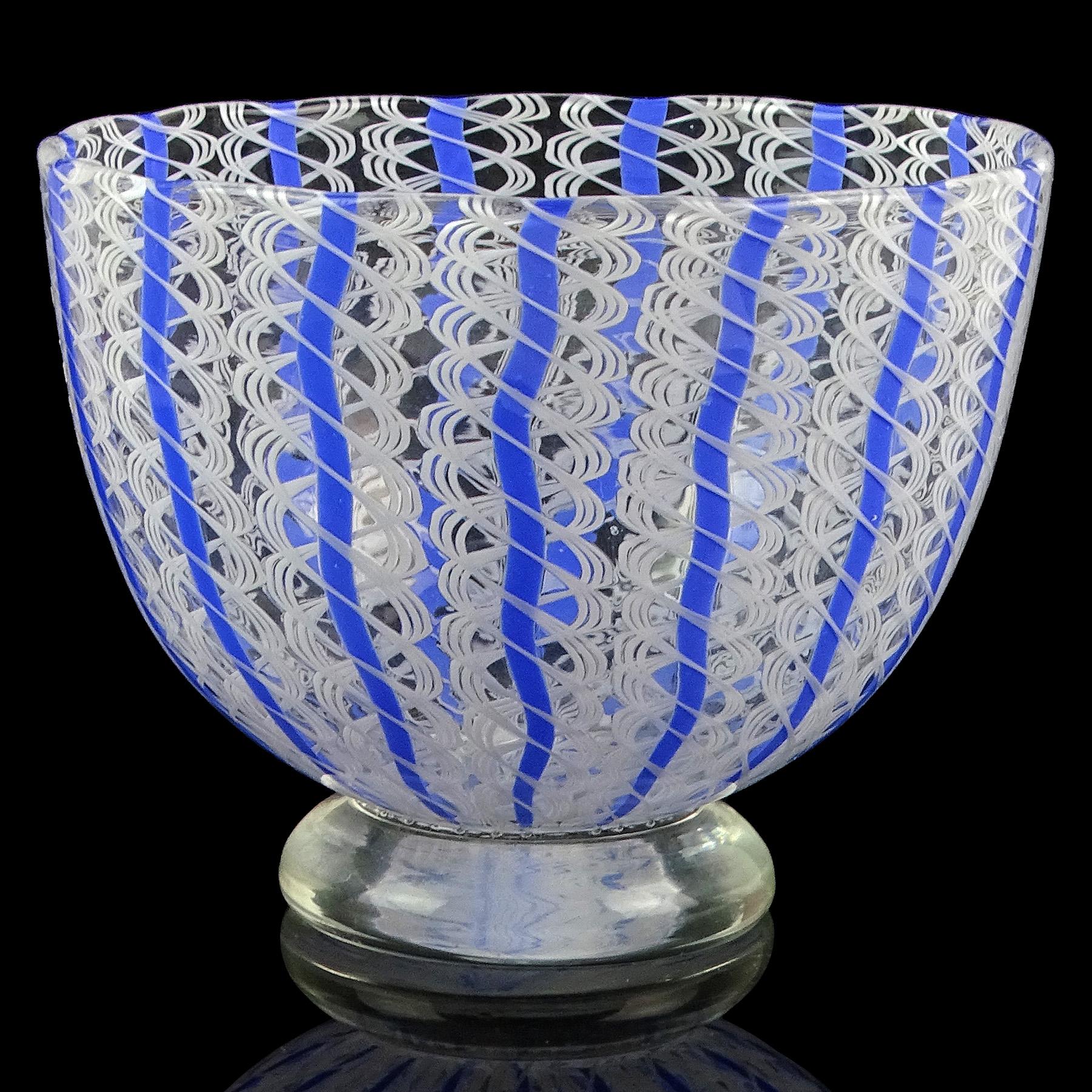 Beautiful vinrtage Murano hand blown blue and white ribbons Italian art glass footed cup bowl / dish. Documented to designer Archimede Seguso, circa 1950s. The bowl is made with white twisting ribbons, with a blue line going through inside. It has
