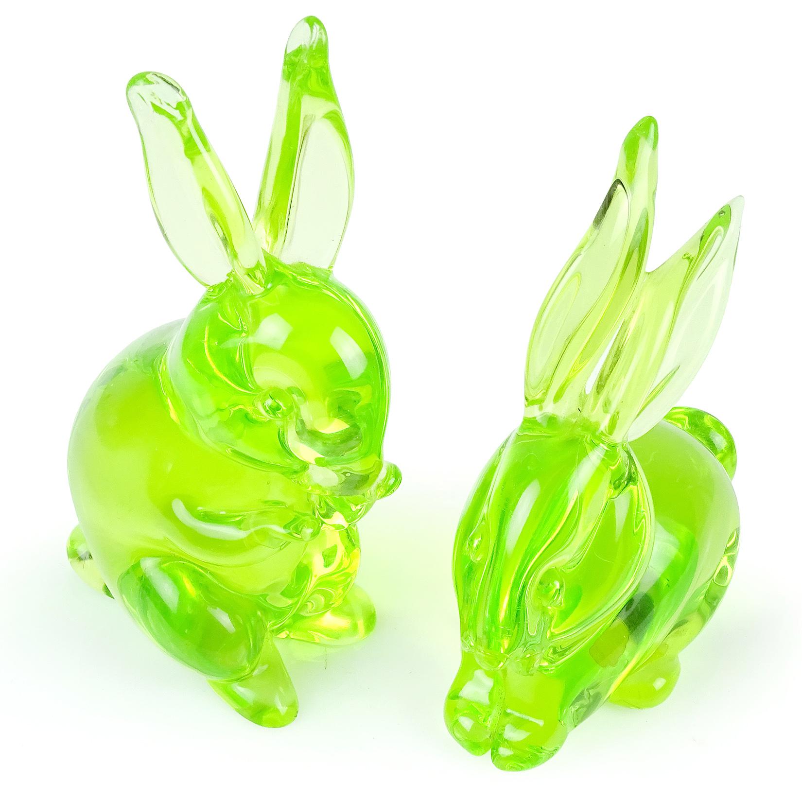 Beautiful and very cute set of Murano hand blown bright green Italian art glass bunny rabbit sculptures or figurines. Documented to designer Archimede Seguso. One still retains the original 