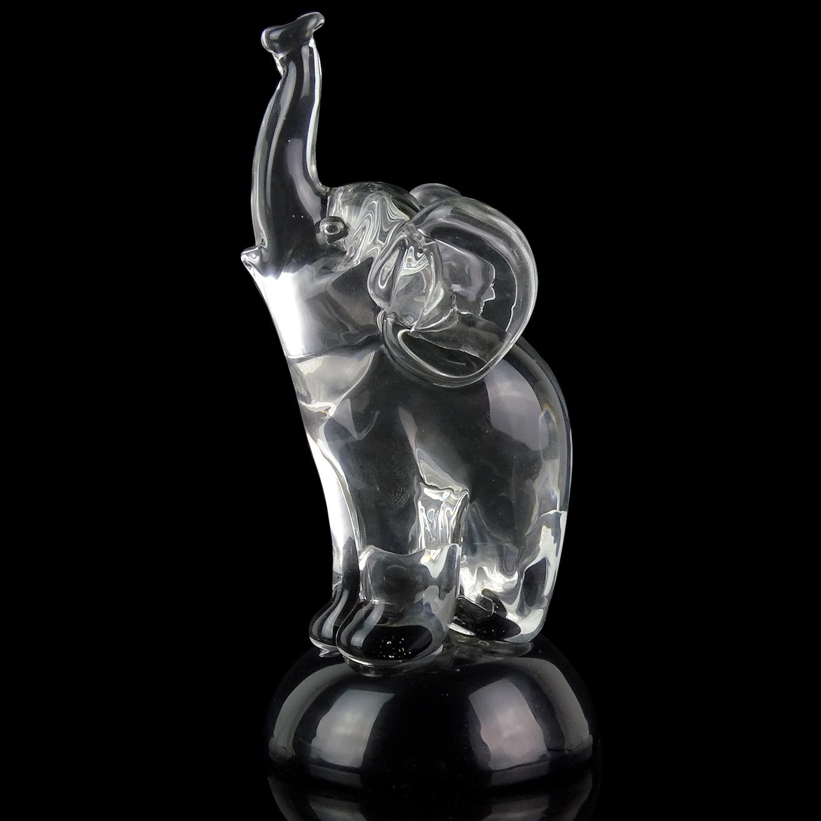 Beautiful vintage murano hand blown crystal clear on black base Italian art glass elephant sculpture. Documented to designer Archimede Seguso, with original 