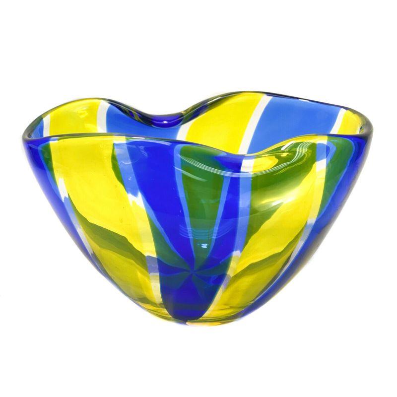 Archimede Seguso Murano for Tiffany & Co. Art Glass bowl, signed.

The bowl consisting of cobalt blue and yellow vertical striped hues. A slight ruffled texture to to the top rim. Artist signed Archimede Seguso to the underside base and retailed