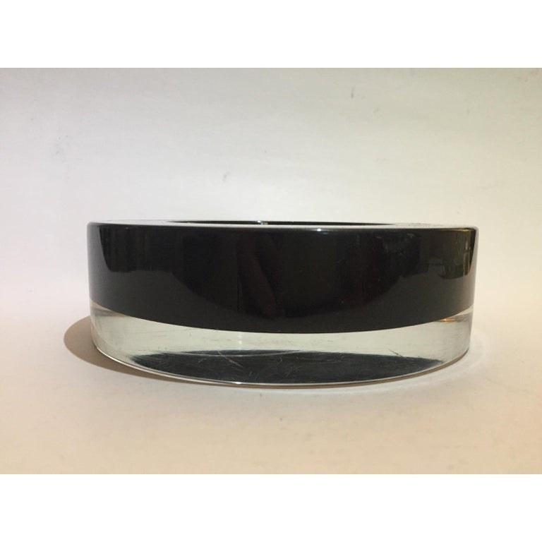 This stylish clean lined Murano glass dish was created in the 1970s-1980s by Archimede Seguso. The coloration is clear (colorless) and black.

Note: Acid etched on the verso Archimede Seguso Murano Italy (see image).

Note: Minor surface wear on