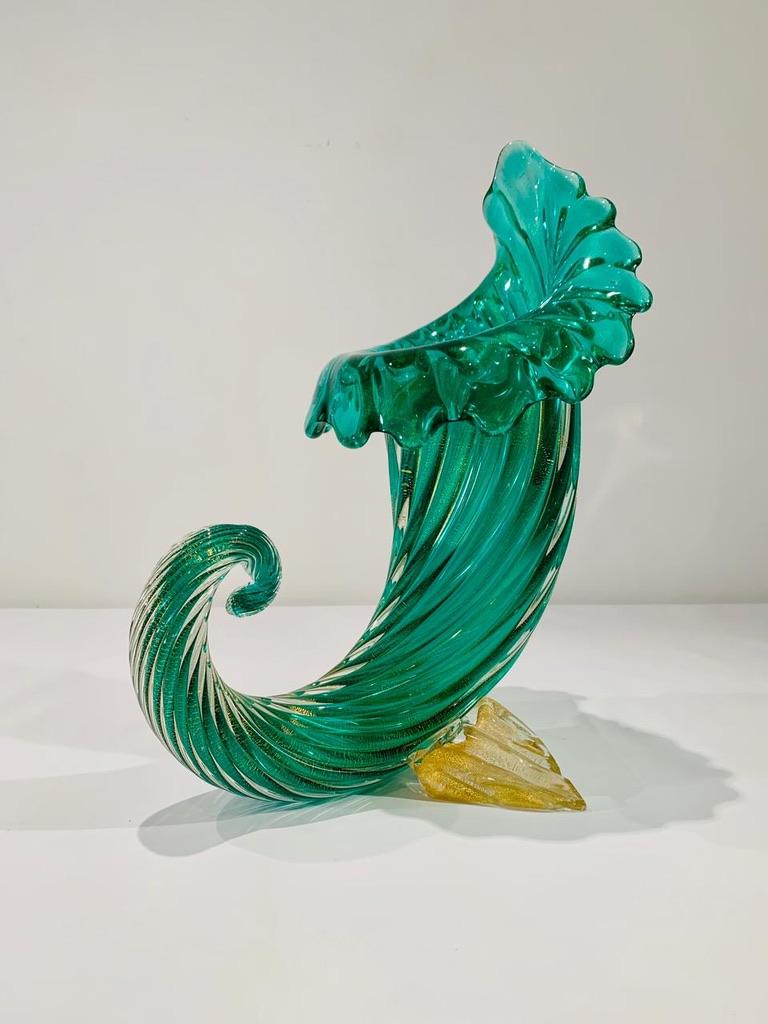 Incredible and Big Archimede Seguso Murano glass green cornucopia in costolato oro with applied parts circa 1950.