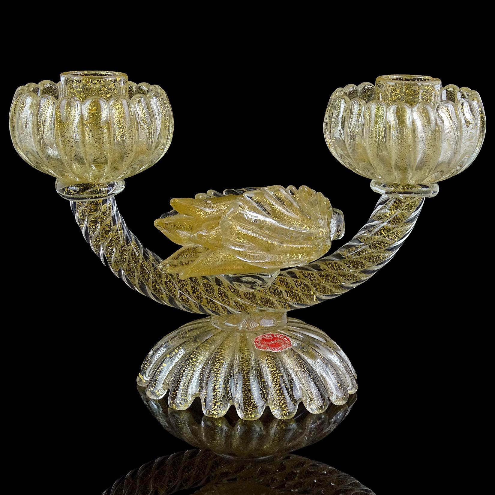 Beautiful vintage Murano hand blown gold flecks with attached flower Italian art glass double candlestick. Documented to designer Archimede Seguso, circa 1950s. It has 2 original labels still attached to the top and bottom of the piece. A large