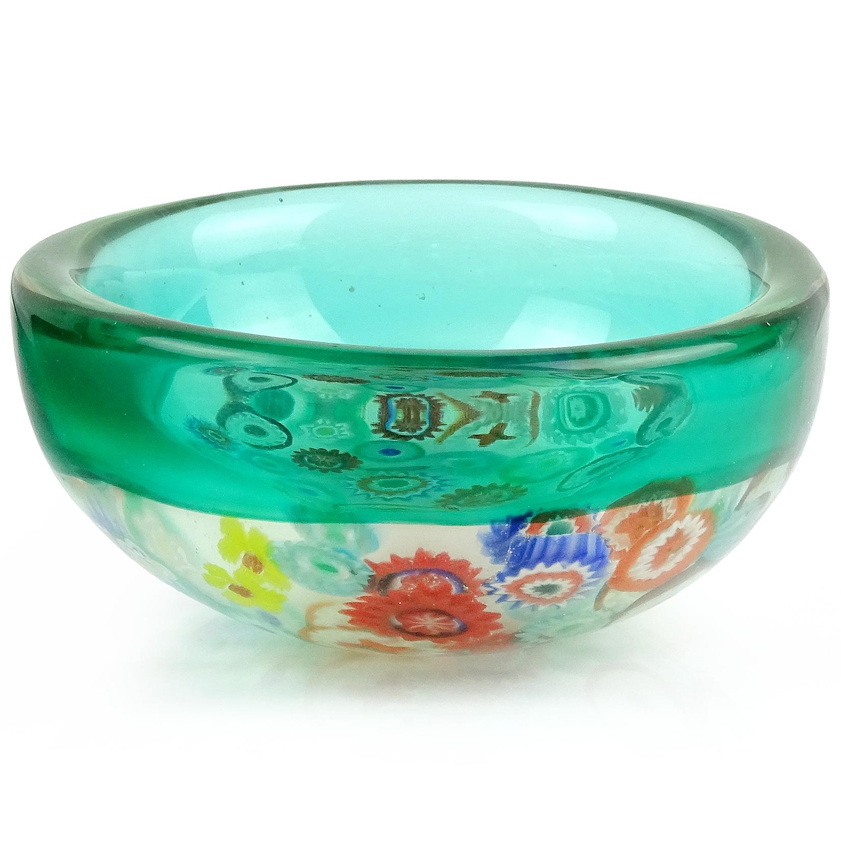 Beautiful vintage Murano hand blown Millefiori flower canes and green Incalmo rim Italian art glass round bowl. Documented to designer Archimede Seguso. The murine pieces are all different colors and designs. Can be used as a display piece on any