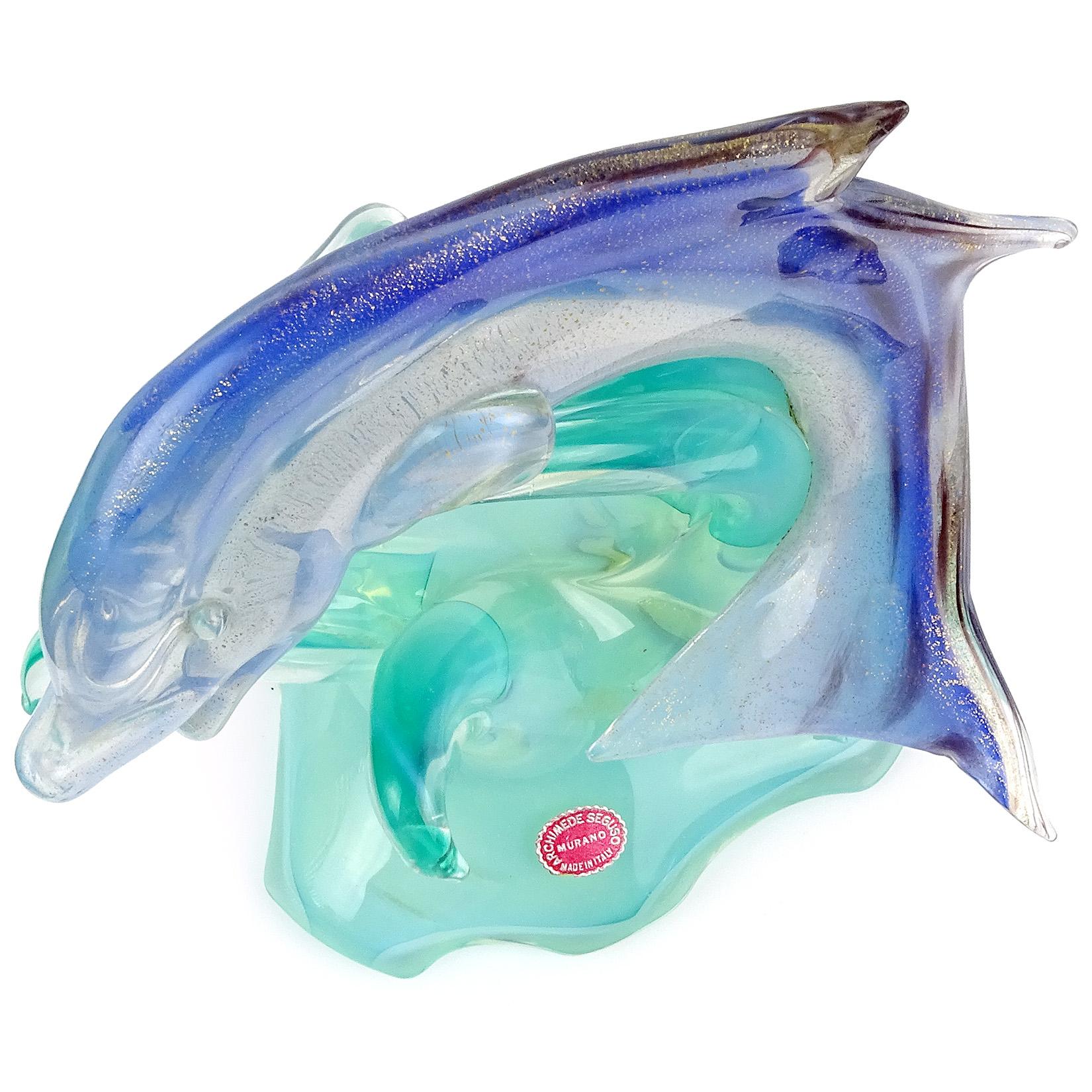 Beautiful vintage Murano hand blown opalescent green, blue, dark spots and gold flecks Italian art glass leaping dolphin or fish sculpture. Documented to designer Archimede Seguso, and published in his 