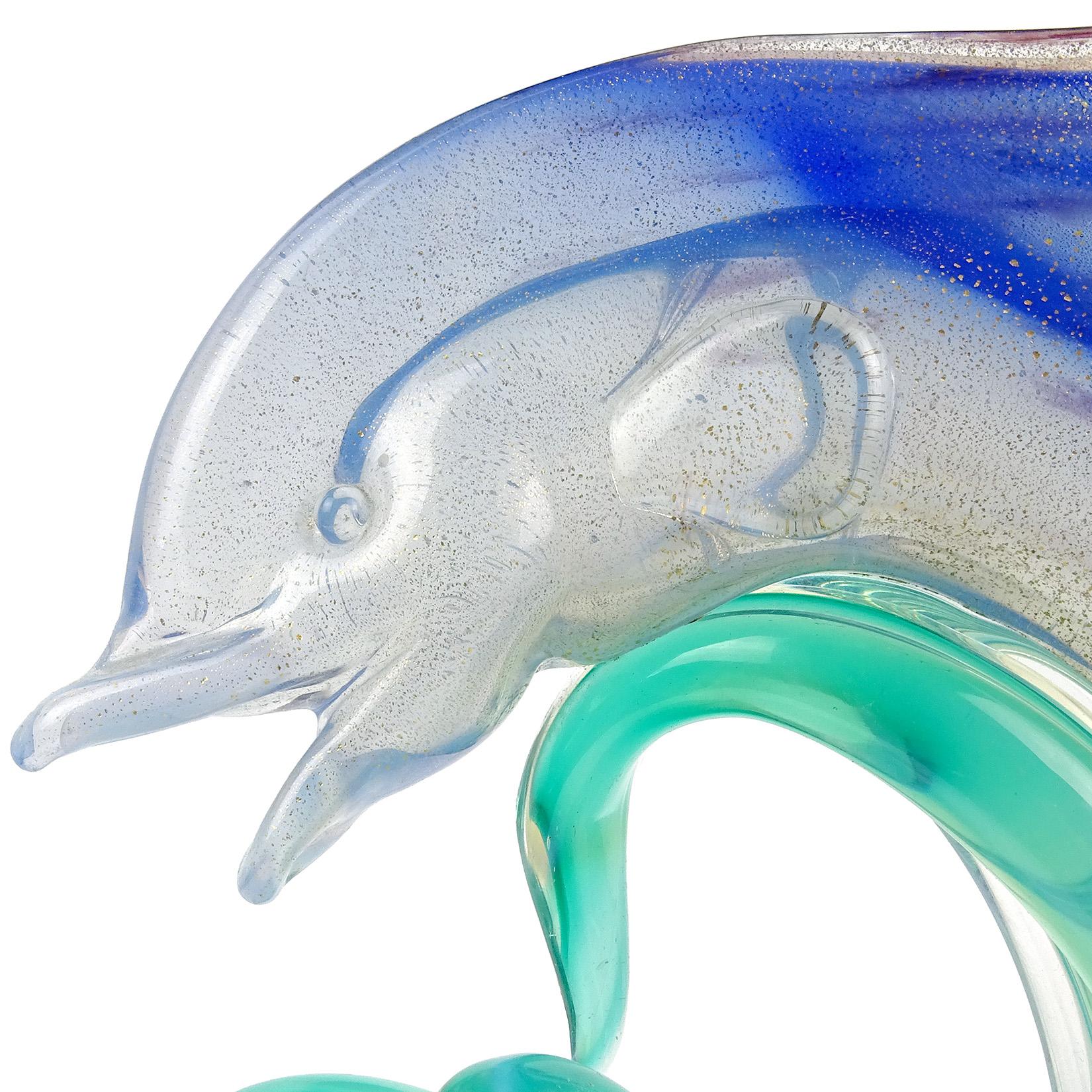 blown glass dolphin figurines