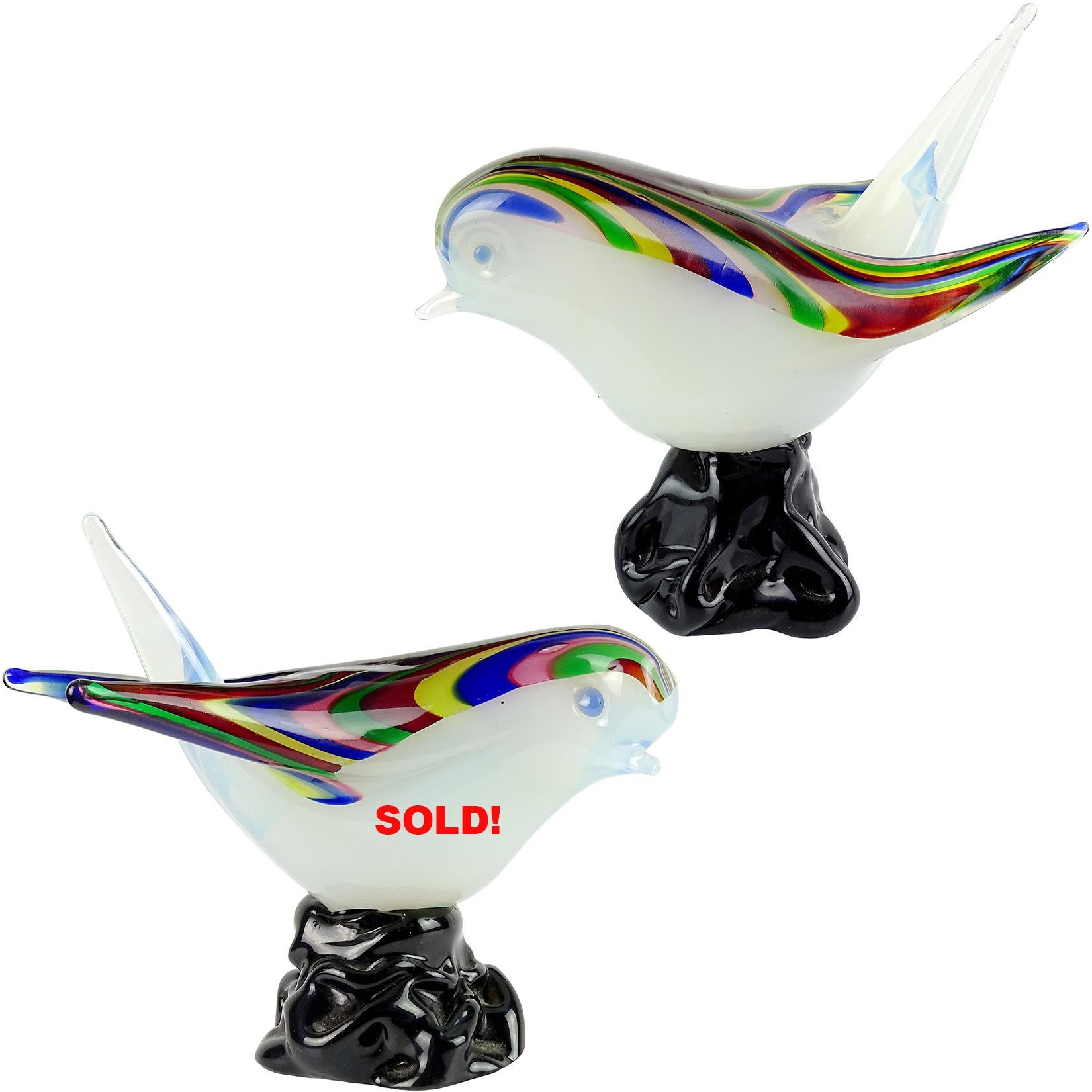 Only 1 Left - Beautiful Murano hand blown, opalescent white, with rainbow color feathers Italian art glass bird figurines / sculptures. Documented to designer Archimede Seguso. They Stand on black rock form bases. Very unusual design and color