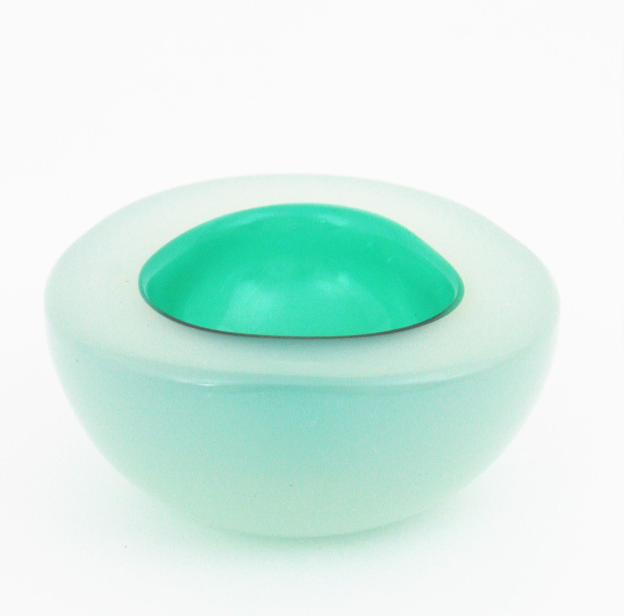 Green white geode triangular bowl, Murano glass. Italy, 1950s.
Hand blown Murano glass Sommerso geode bowl in aqua green and opalescent white color attributed to Archimede Seguso. 
Aqua Green and opal white glass cased into clear glass.
Lovely to be