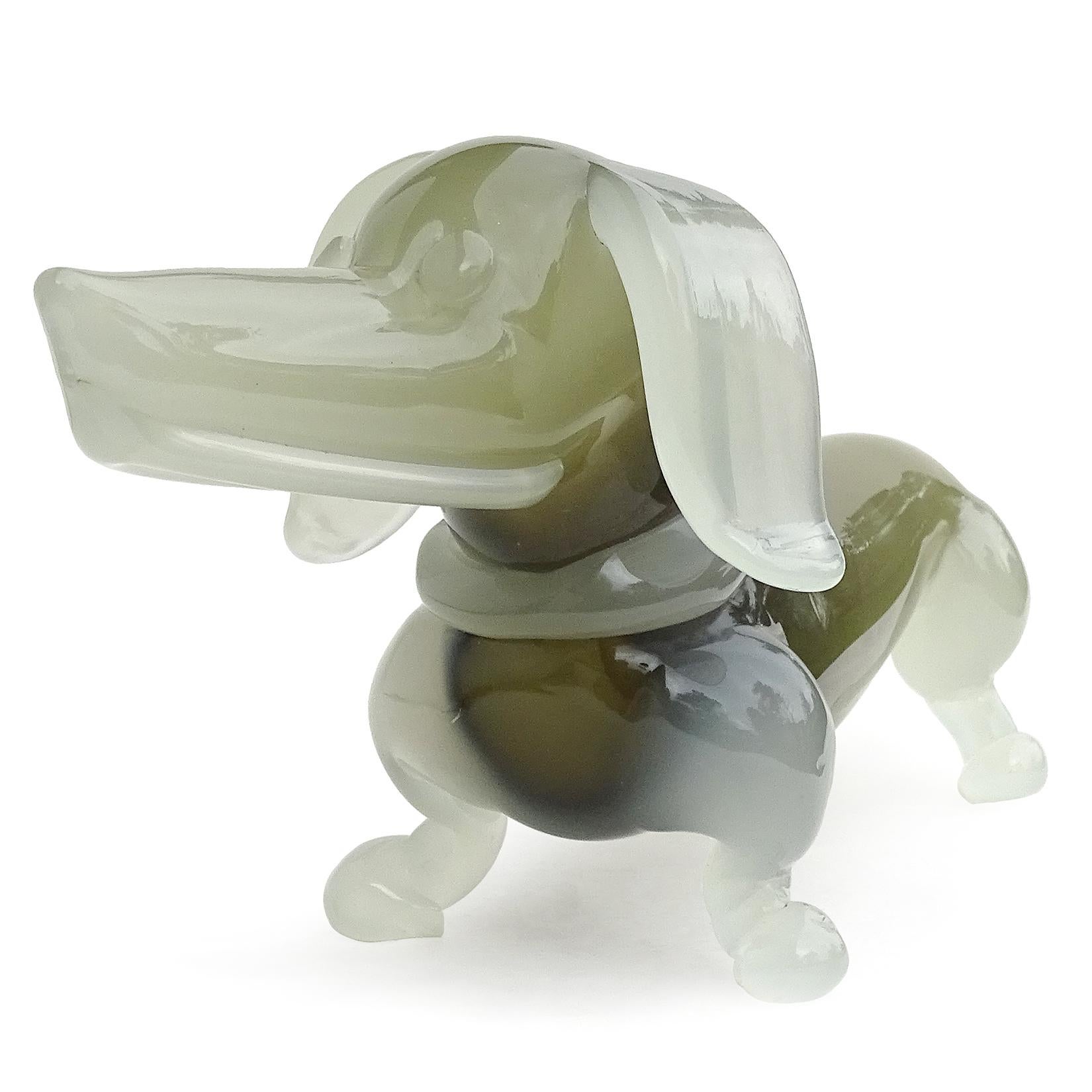 Beautiful and rare Murano hand blown opalescent white and olive green Italian art glass Dachshund puppy dog sculpture. Documented to designer Archimede Seguso, in his 