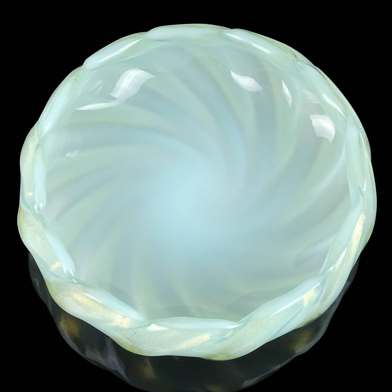 Beautiful vintage Murano hand blown opal white with very soft blue overlay, and gold flecks Italian art glass decorative bowl. Documented to designer Archimede Seguso, with original Murano label underneath. The piece is profusely covered in gold