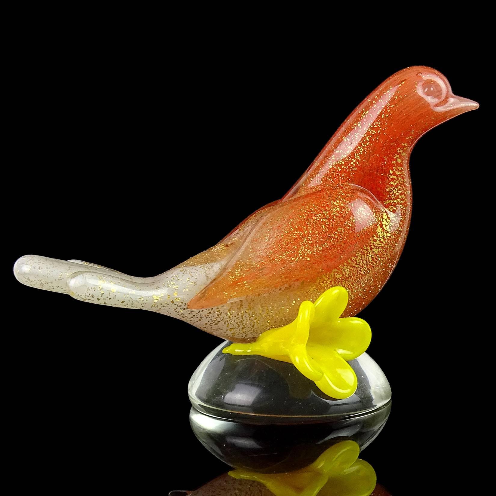 Beautiful vintage Murano hand blown orange, white and gold flecks Italian art glass bird with flower sculpture / paperweight. Documented to designer Archimede Seguso. The piece is profusely covered in gold leaf, with an “ombre” fade from orange to
