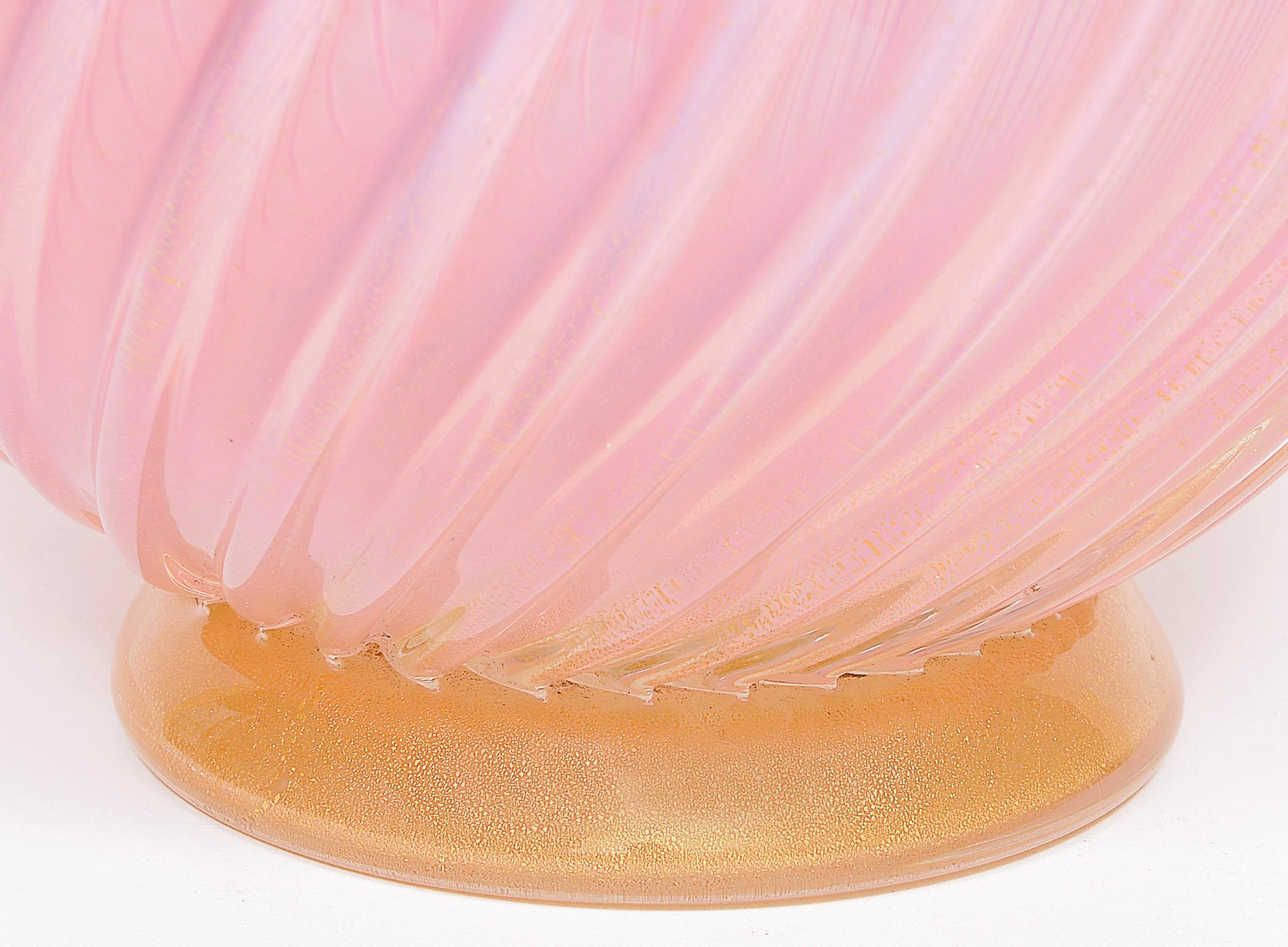 Large vase in artistic Murano glass with ribbed and twisted body in pale pink glass and collar applied in hot pink glass and base also applied in glass and gold, all with gold leaf.