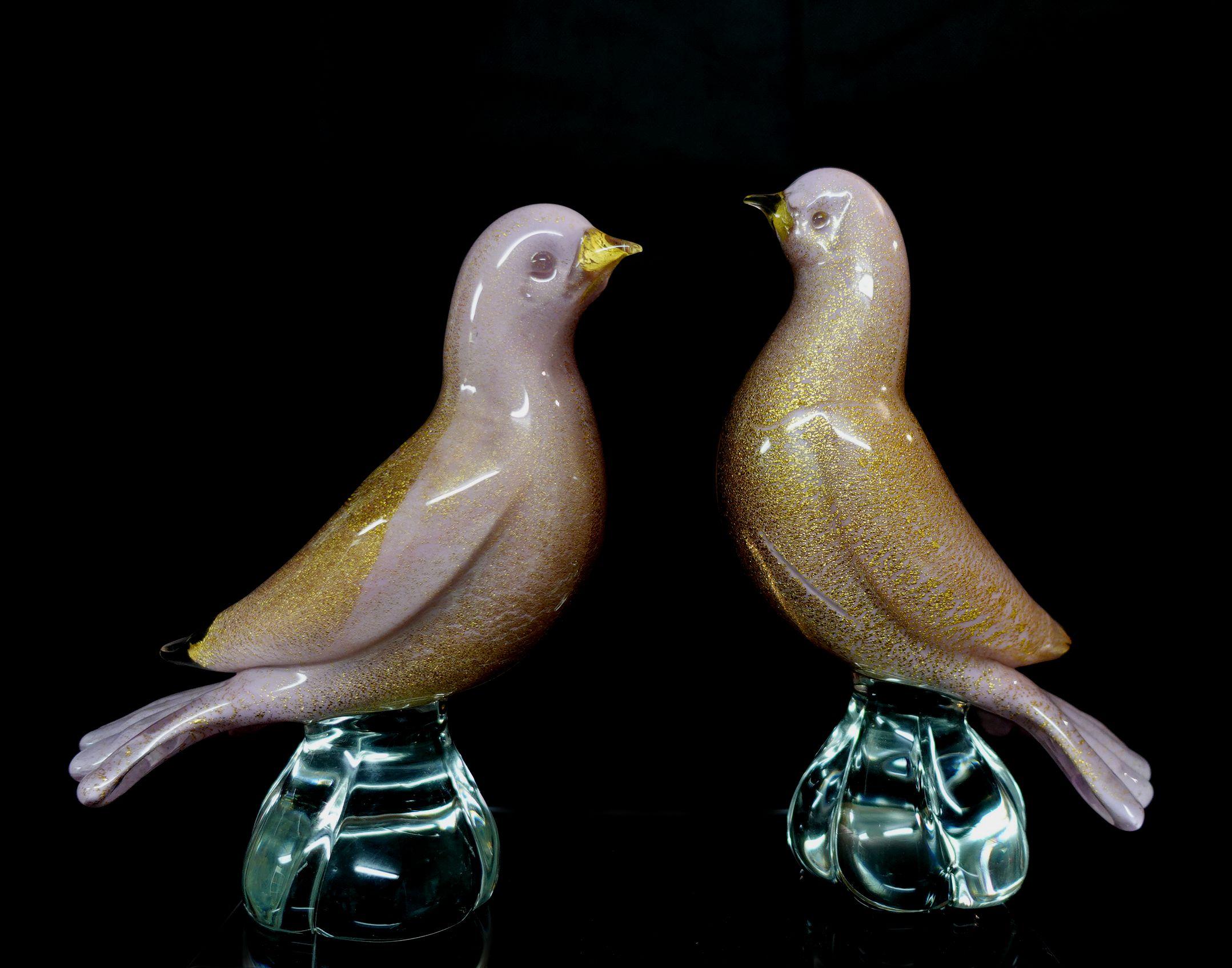 Beautiful and very cute set of Murano hand-blown Pink Gold Flecks Italian Art Glass Dove Birds Documented to designer Archimede Seguso, in the “Pulveri” technique. One still retains the original 