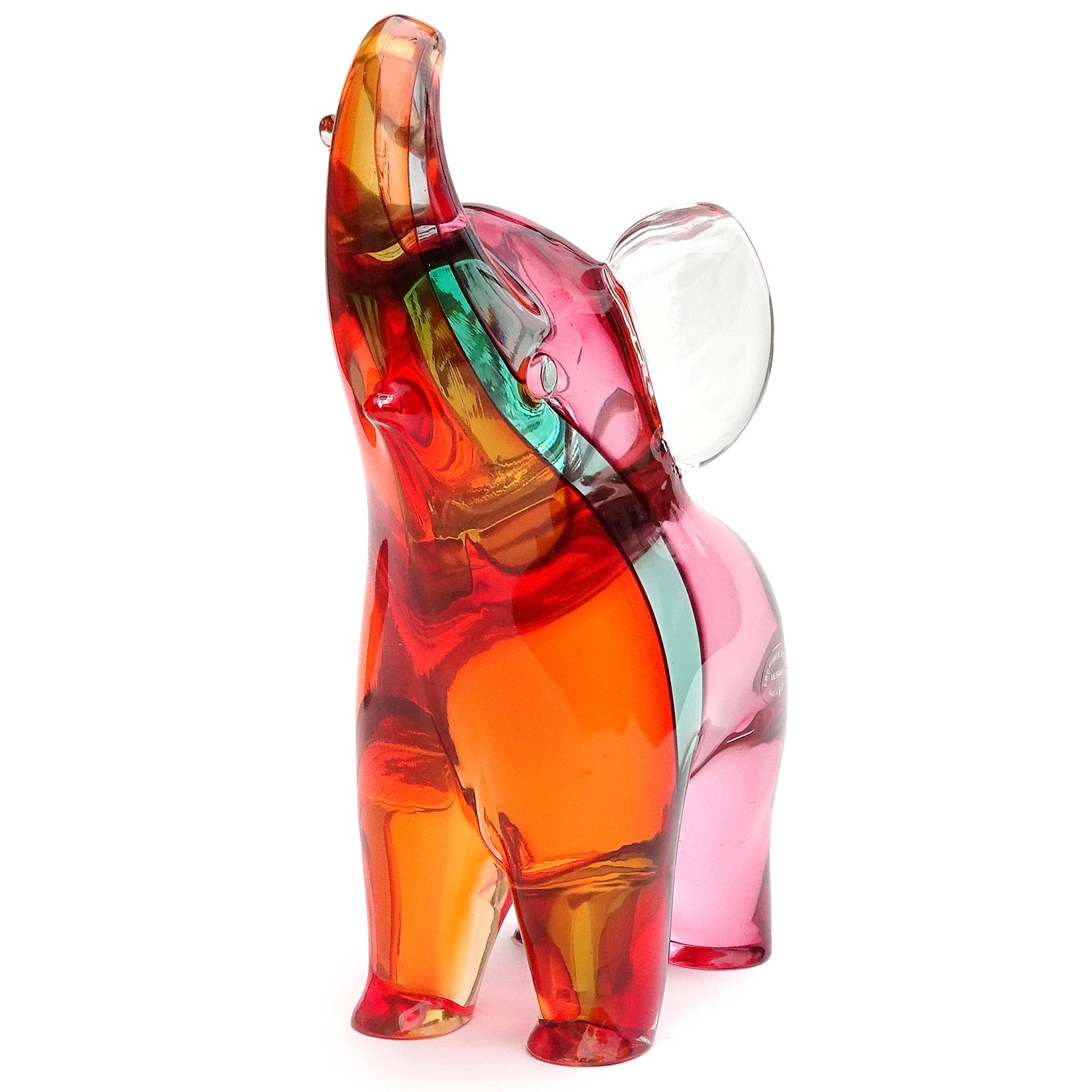 Beautiful Murano hand blown Sommerso rainbow colors Italian art glass elephant sculpture. Documented to designer Archimede Seguso, circa 1980s. It has both an original label, 