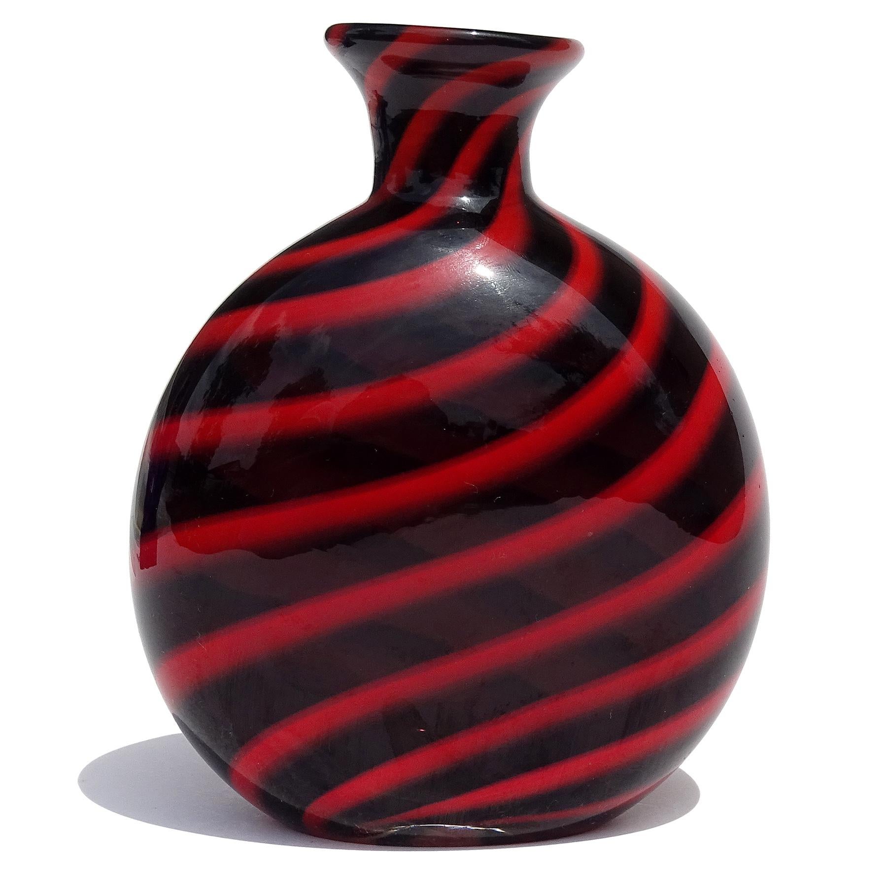 Beautiful vintage Murano hand blown black and red swirl Italian art glass flower vase. The piece documented to designer Archimee Seguso, and fully signed 