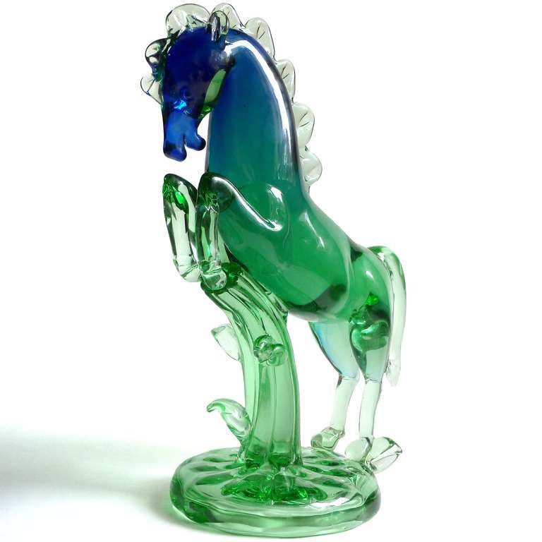 Rare Murano Sommerso cobalt blue and green Italian art glass rearing stallion sculpture. Documented to designer Archimede Seguso, and published in his book. The base and support are made to look like a tree trunk. The piece is well detailed, from