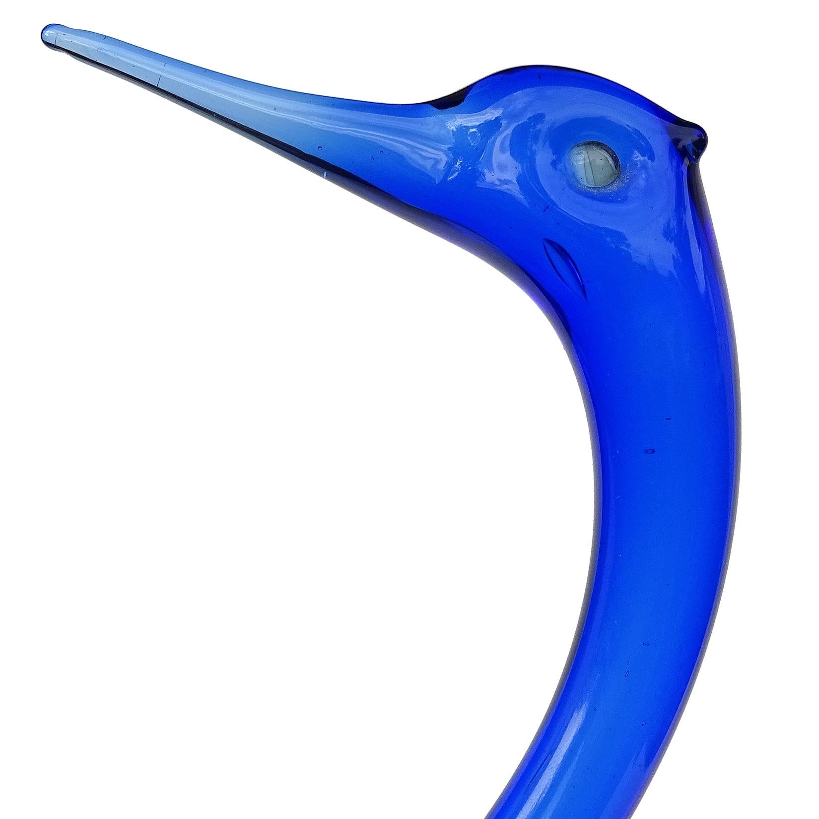 Beautiful vintage Murano hand blown Sommerso cobalt blue and aqua blue Italian art glass swan bird sculpture. Documented to designer Archimede Seguso, with remnants of his large red label underneath. Very elegant shape. Would make a great display