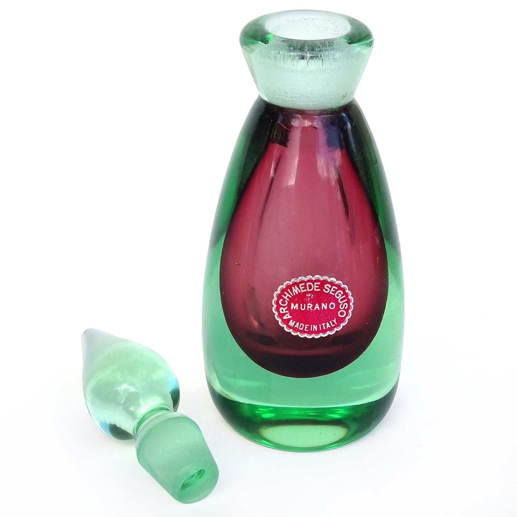 Beautiful vintage Murano hand blown Sommerso light green over red Italian art glass perfume bottle. Documented to designer Archimede Seguso, with original and intact 
