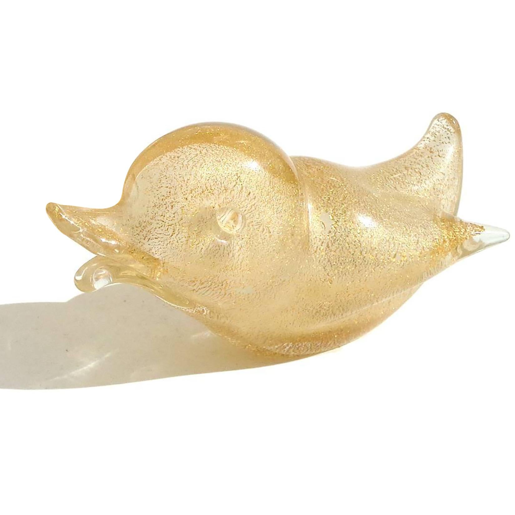 Beautiful vintage Murano hand blown white and gold flecks Italian art glass baby bird sculpture. Documented to designer Archimede Seguso, with original label underneath. The figurine is profusely covered in gold leaf. Could be used as a paperweight.