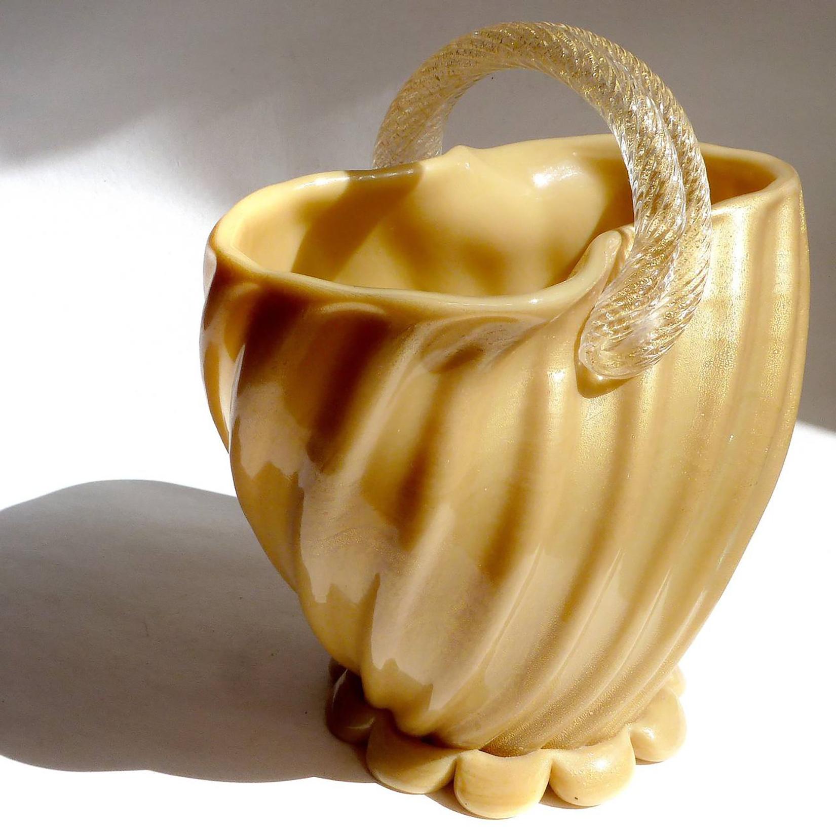 Rare and beautiful, large vintage Murano hand blown yellow and gold flecks Italian art glass basket flower vase. Documented to designer Archimede Seguso, circa 1952. This particular piece was photographed by me, and published in the Archimede Seguso
