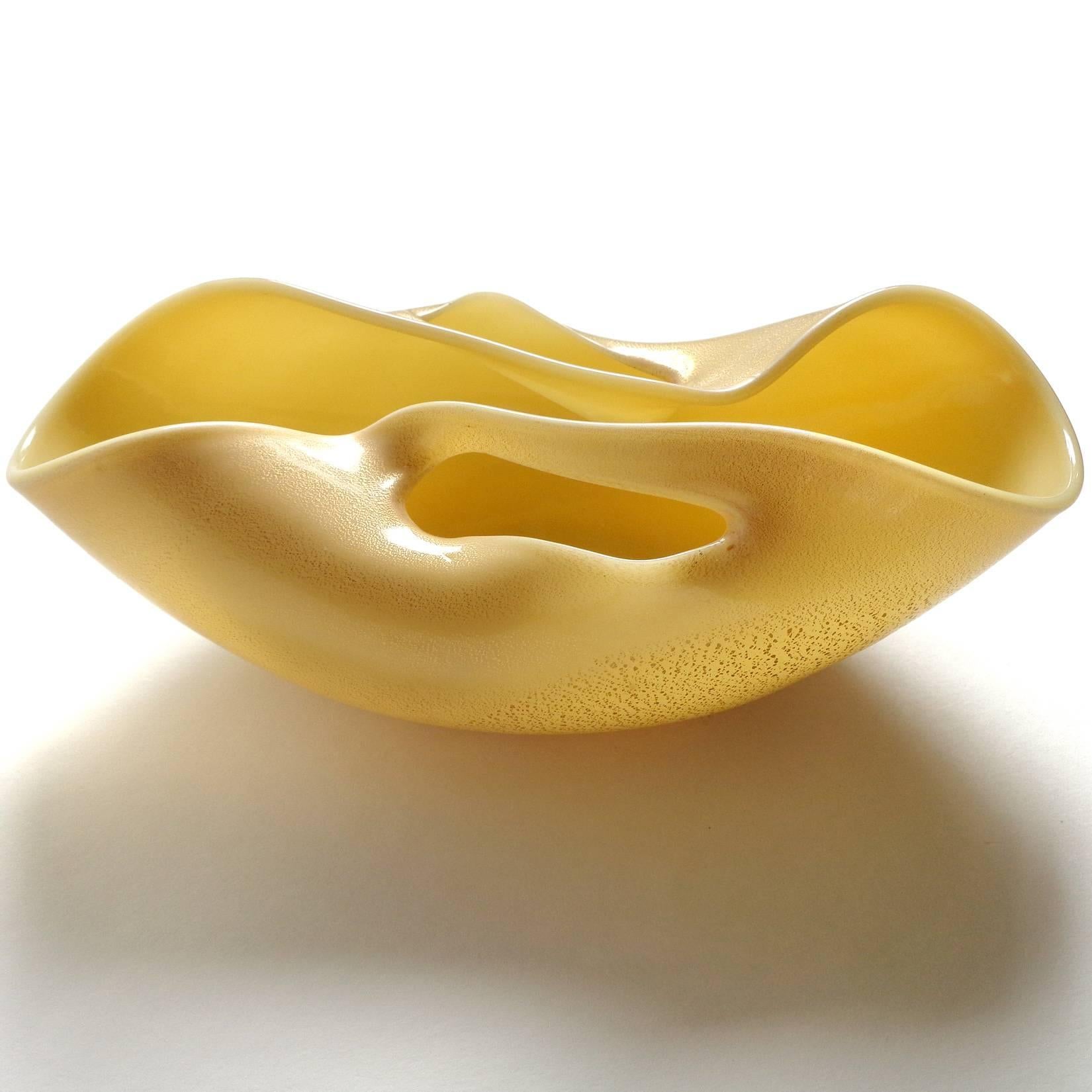 Beautiful and rare, vintage Murano hand blown yellow and gold flecks art glass sculptural bowl. Documented to designer Archimede Seguso, and published in his book 