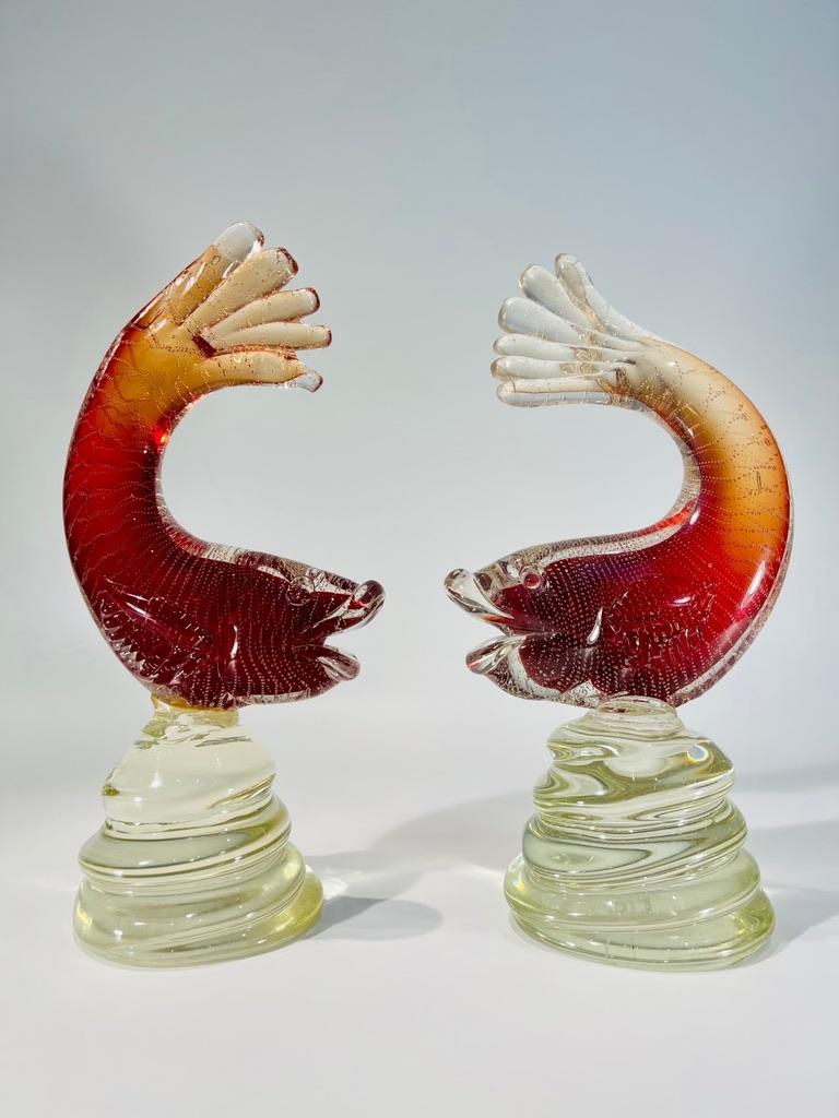 Incredible pair of fishes in red Murano glass by Archimede Seguso with air bubbles circa 1950.