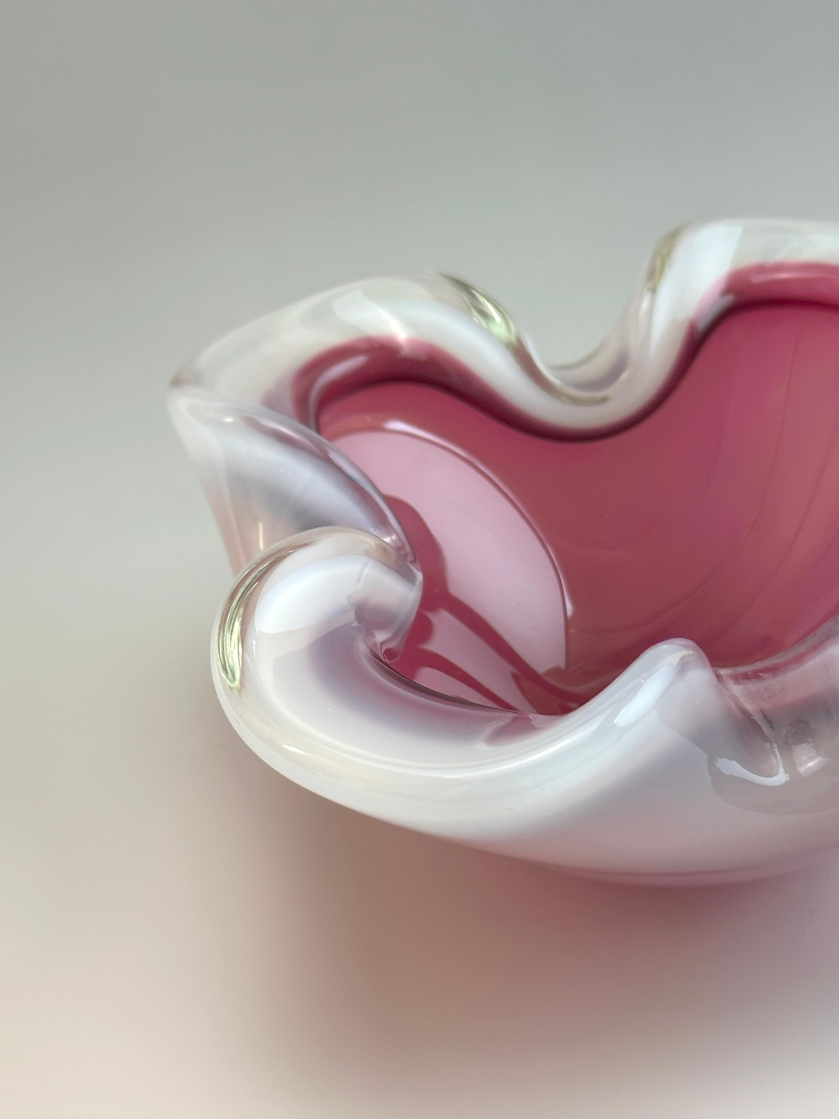 A bold and colourful Murano glass bowl by Archimede Seguso, crafted in Italy during the 1960s using the traditional sommerso technique. The form blends layers of translucent white alabastro glass—named after the softly glowing, semi-opaque