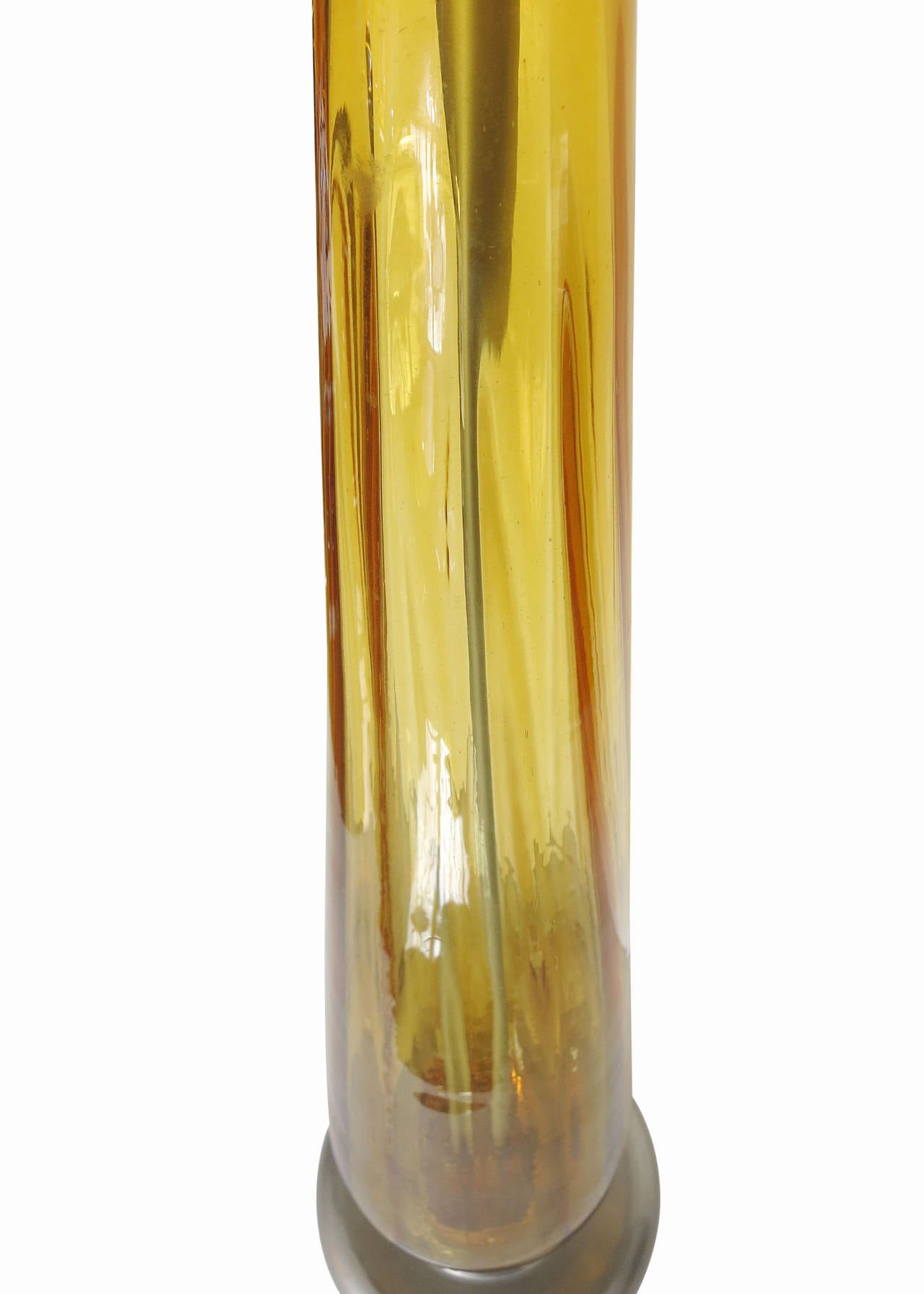 This piece is a luscious opaline yellow Murano glass lamp with aluminum collars mounted on polished aluminum bases. The lamp's design is reminiscent of the same made famous by Archimede Seguso and is sure to fit any setting.

This lamp is 30.5