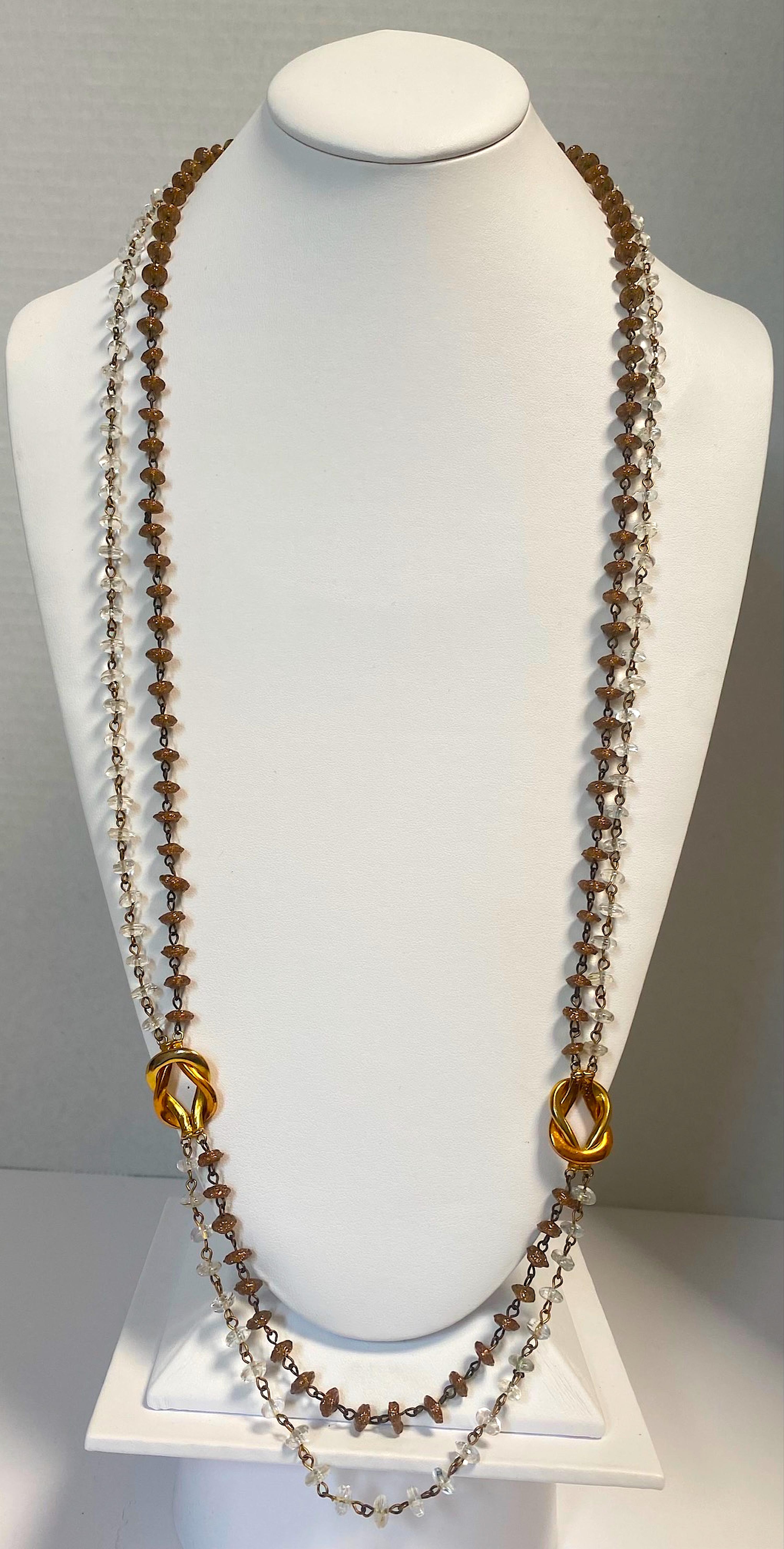 A beautiful and rare design glass bead necklace by famous Italian glass house Seguso. The two stands are comprised of hand made small disk beads individually hand made. Each bead is unique and irregular in shape intensionally. The inner stand is