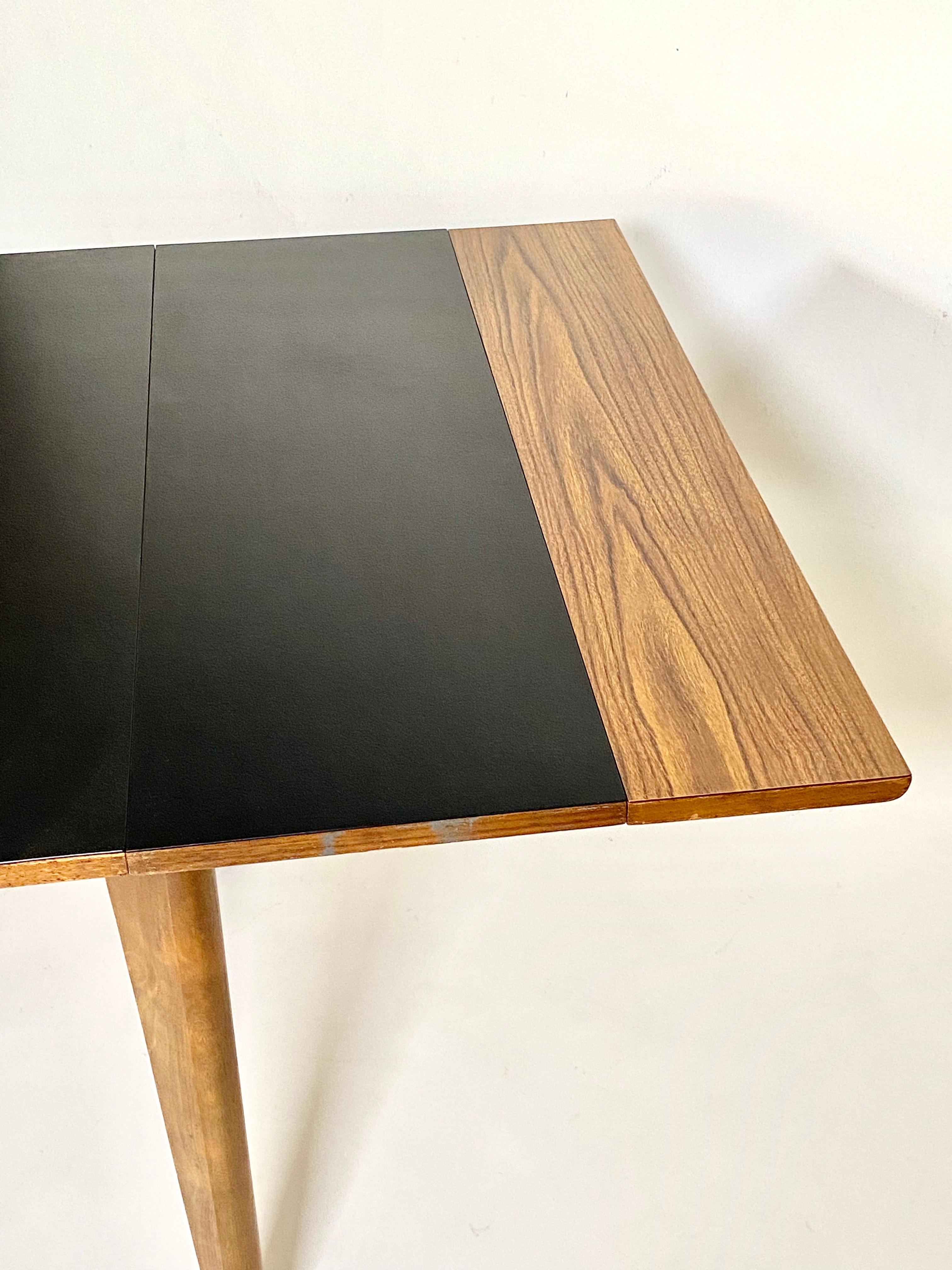 Expanding dining table by Californian / Swedish architect Greta Magnusson Grossman (1906-1999) for Glenn of California circa 1952. She has become a recognized design force in the vintage collectors market over the past decade. This table with a