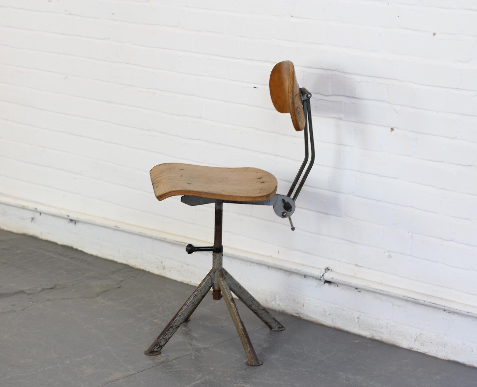 Architects chair by Odelberg & Olson, circa 1940s.

- Thick shaped ply seat and back rest
- Fully adjustable
- Original distributors label
- Attributed to Elias Svedberg
- Swedish, circa 1940s.
- Measures: 41 cm wide x 50 cm deep x 55 cm from