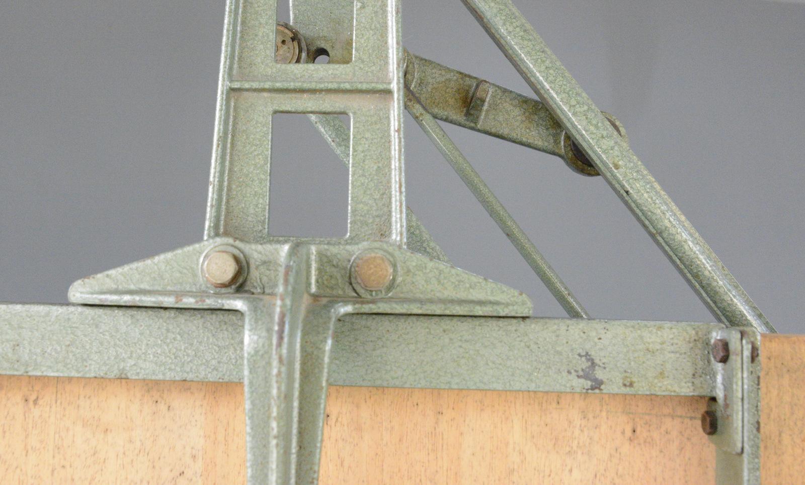 Architects Drawing Board By Nestler Circa 1950s

- Articulated cast iron base
- Height adjustable and pivotable 
- Pine board
- Made by Nestler
- German ~ 1950s
- 150cm wide x 70cm deep x 185cm tall
- 234cm tall including the arm

Condition