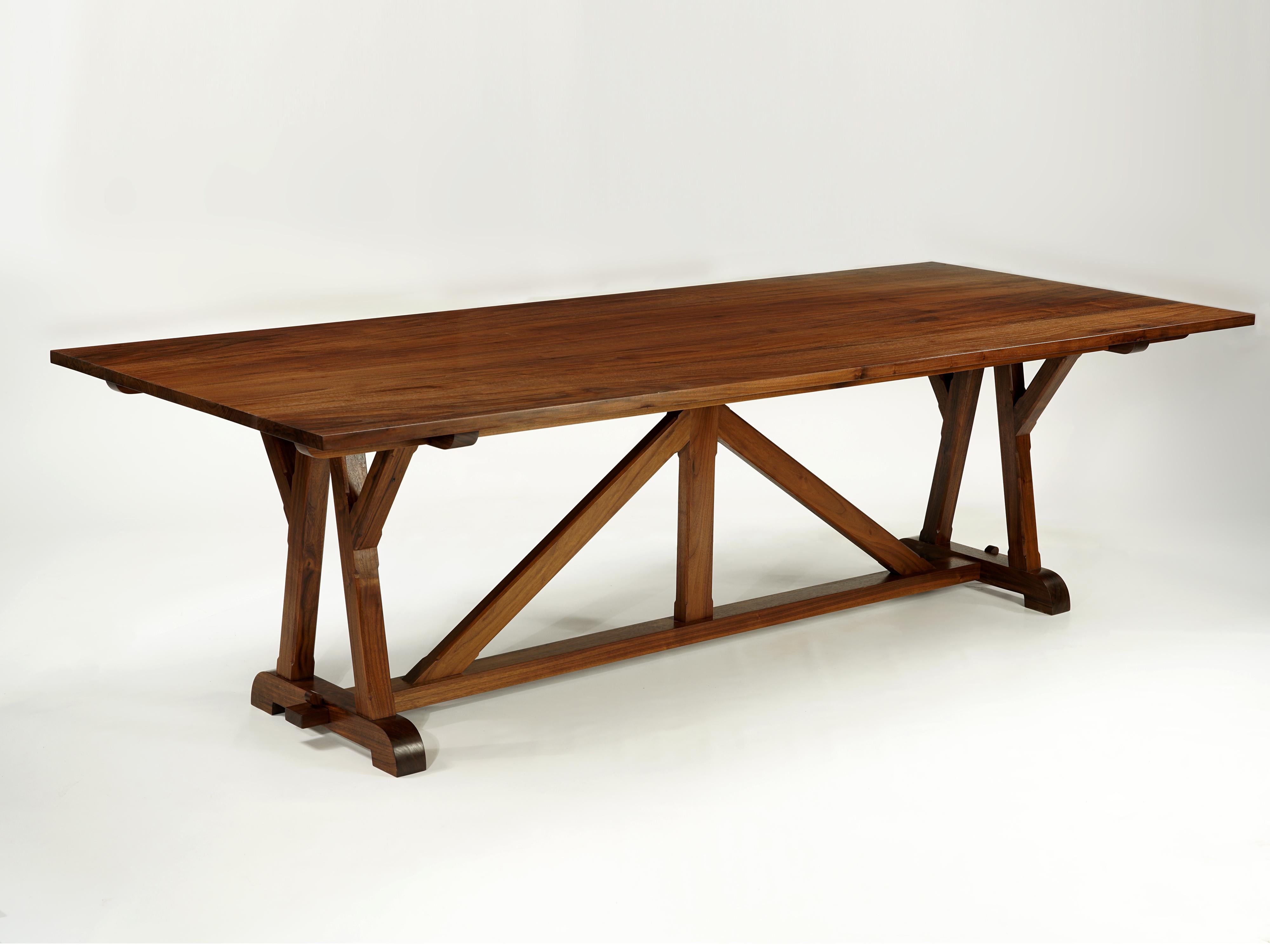This classic design recalls timbered roof trusses used for centuries in
European churches and elsewhere. Exposed beams are connected using
traditional mortise and Tenon joints, forming variations of triangles
that give the rigidity necessary to