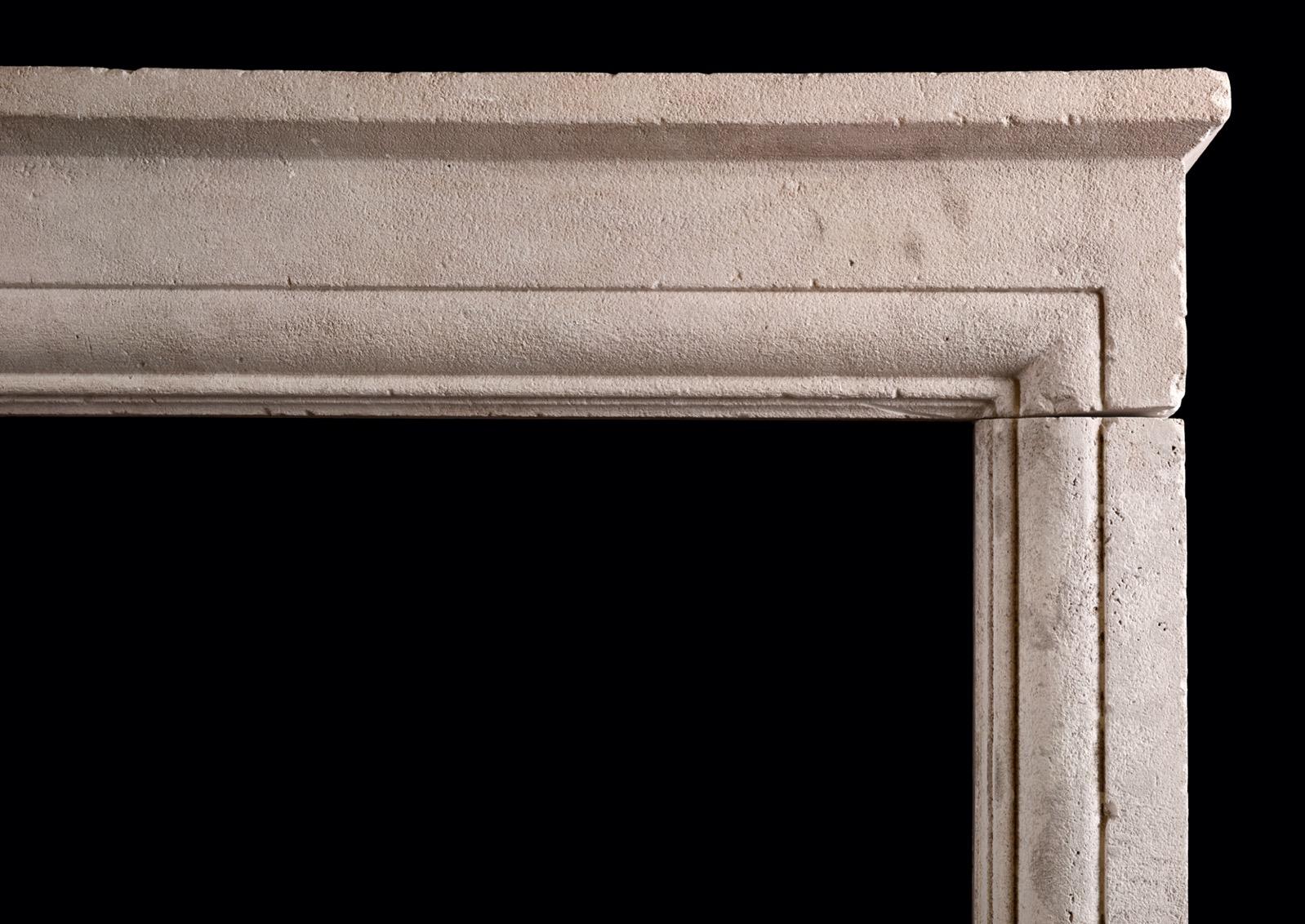 A rustic stone architectural English fireplace. The moulded jambs surmounted by matching frieze and shelf above. (In original rustic condition, but could be restored further upon request.) One of a pair available.

