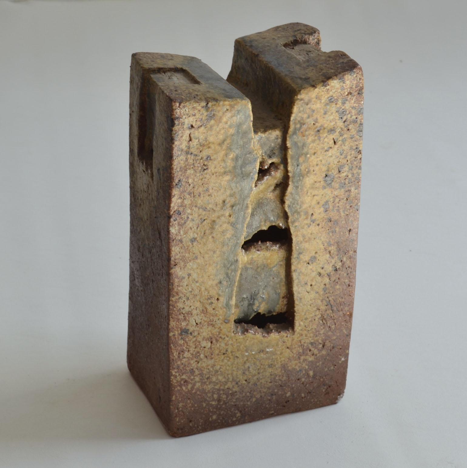 Brutalist architectural abstract ceramic hand formed sculpture in Earth Tones.