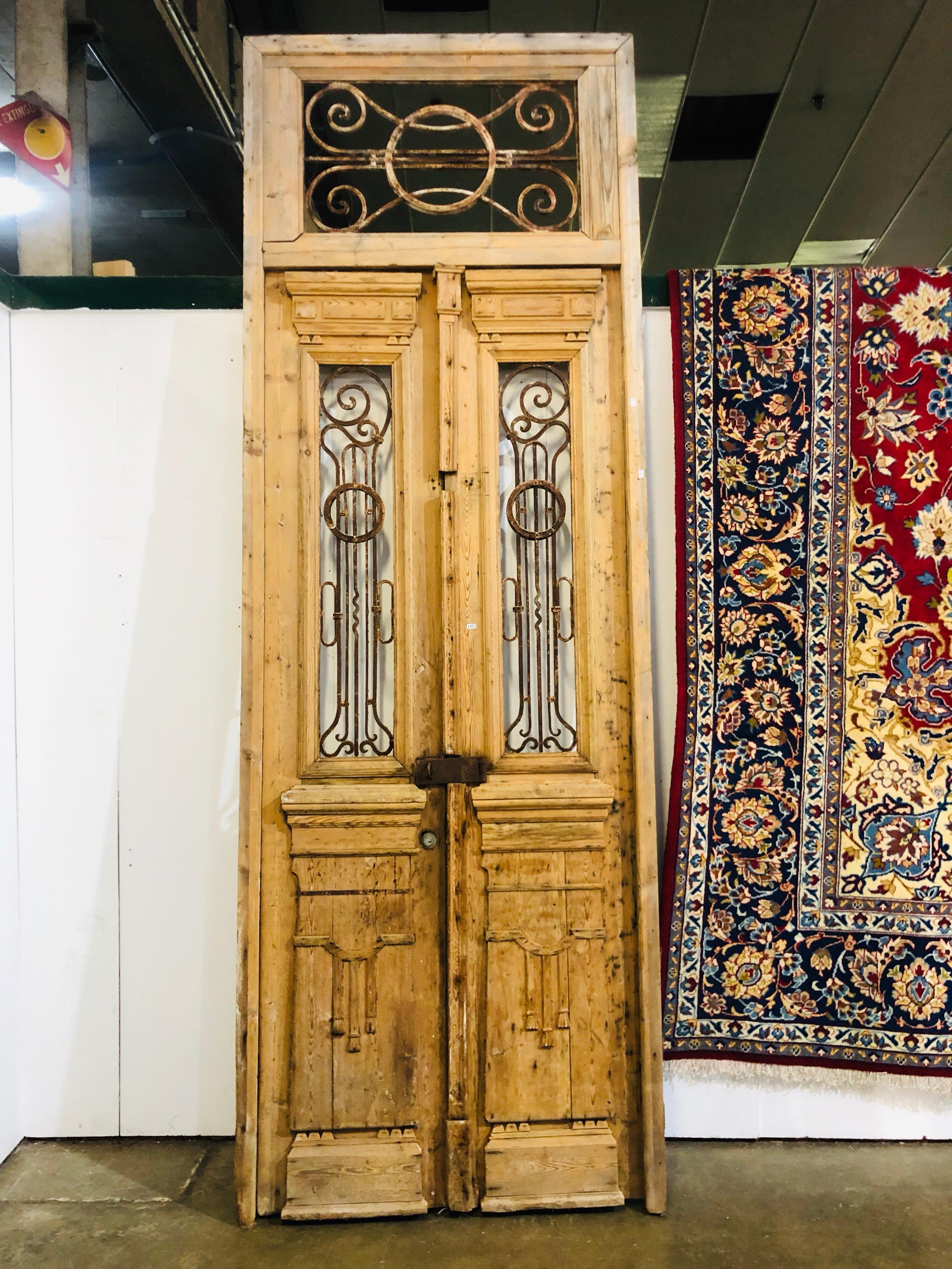Architectural wrought iron and pine French doors
Measures: 310cm total height
245cm high to top of doors
118cm wide 7cm deep.