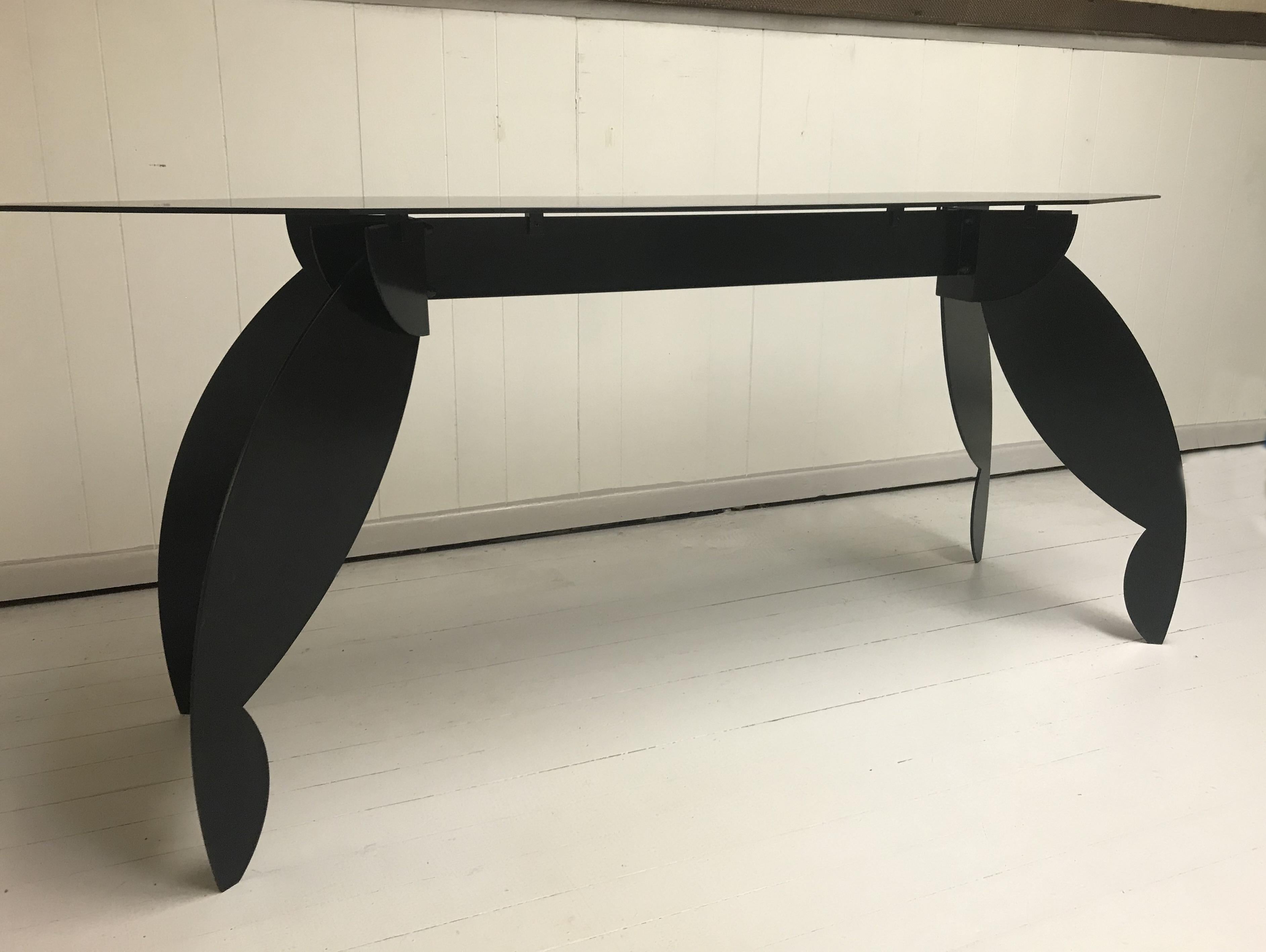 Striking steel console made of black lacquer steel.
This piece is a statement!
It is one of a kind creation by an unknown artist.