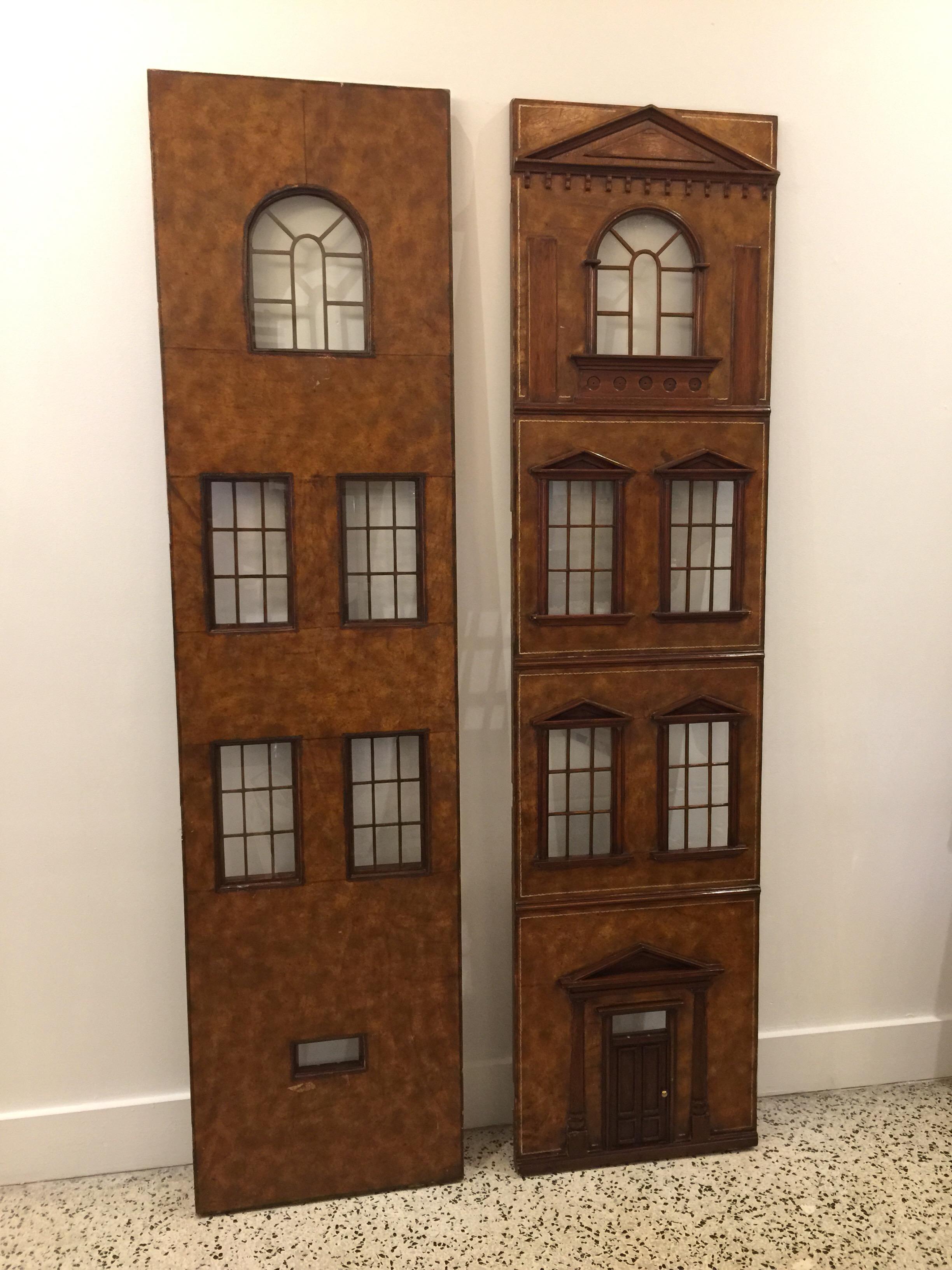 With a classic English building façade, these two door panels with finely crafted details and glass panels are perfect for wall art, etc. Clad in embossed leather on both sides (front and back). Real glass and in 3-D relief.