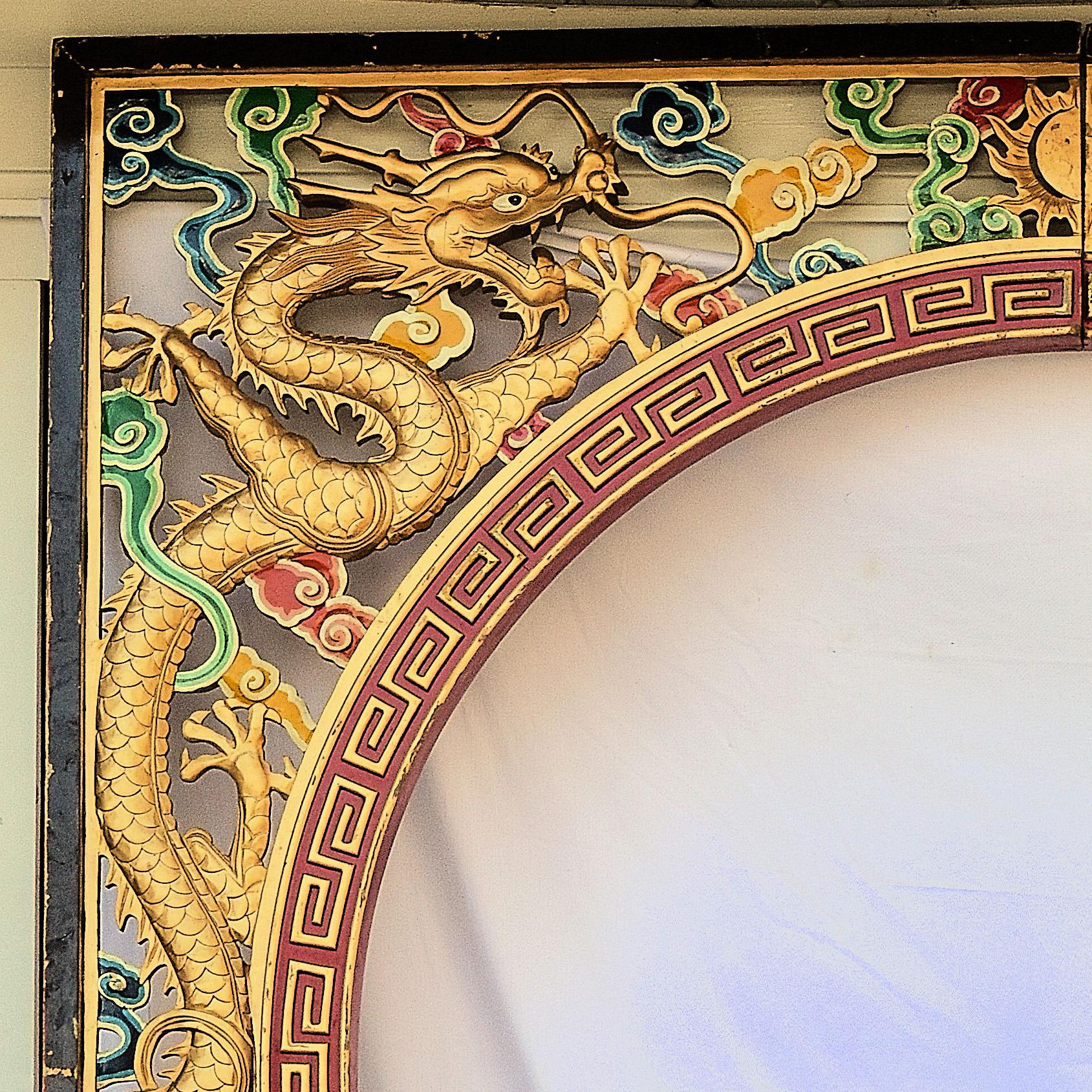 Architectural carved Chinese Dagon and phoenix archway featuring a large 99