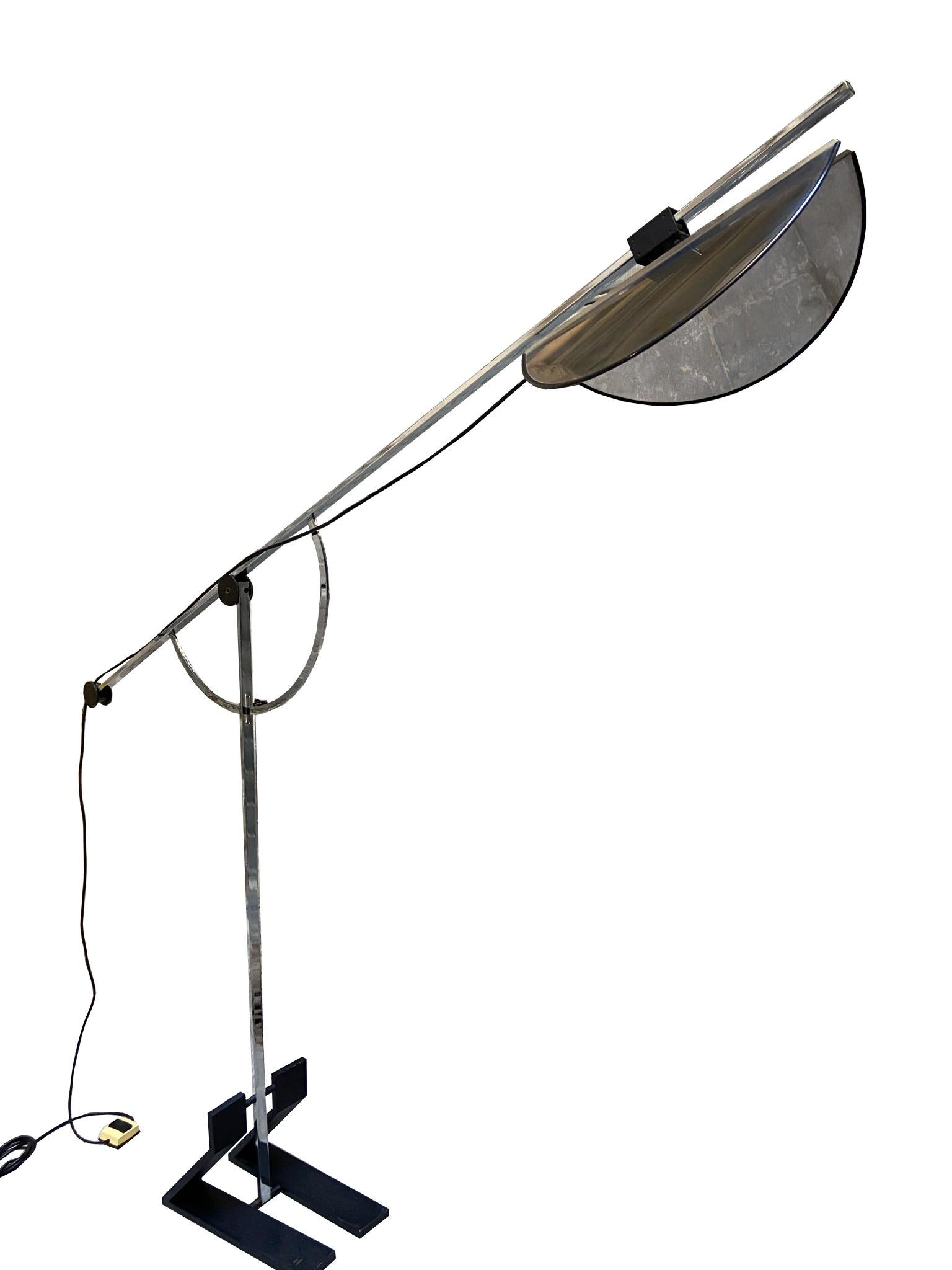 Fabulous chrome floor lamp with adjustable arm and mirror shade.