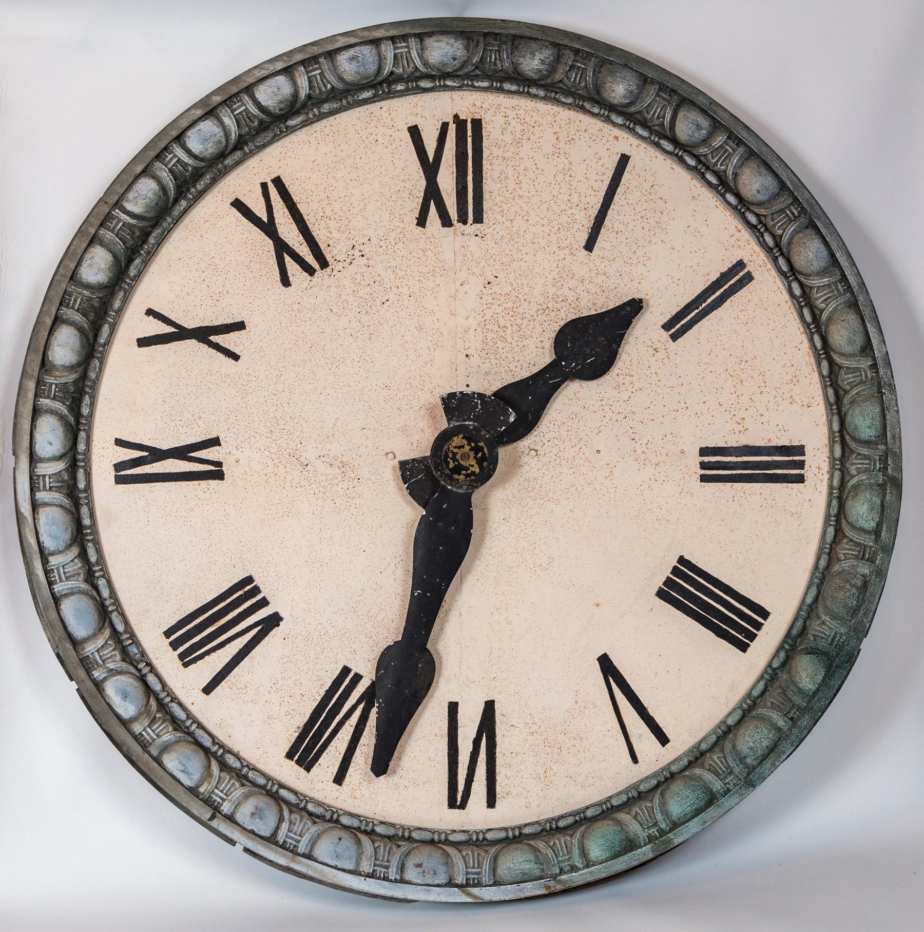 Architectural clock face, France, circa 1900. Striking zinc clock face with unusual detailed border. Original hands. Face and numbers most probably repainted over the years.