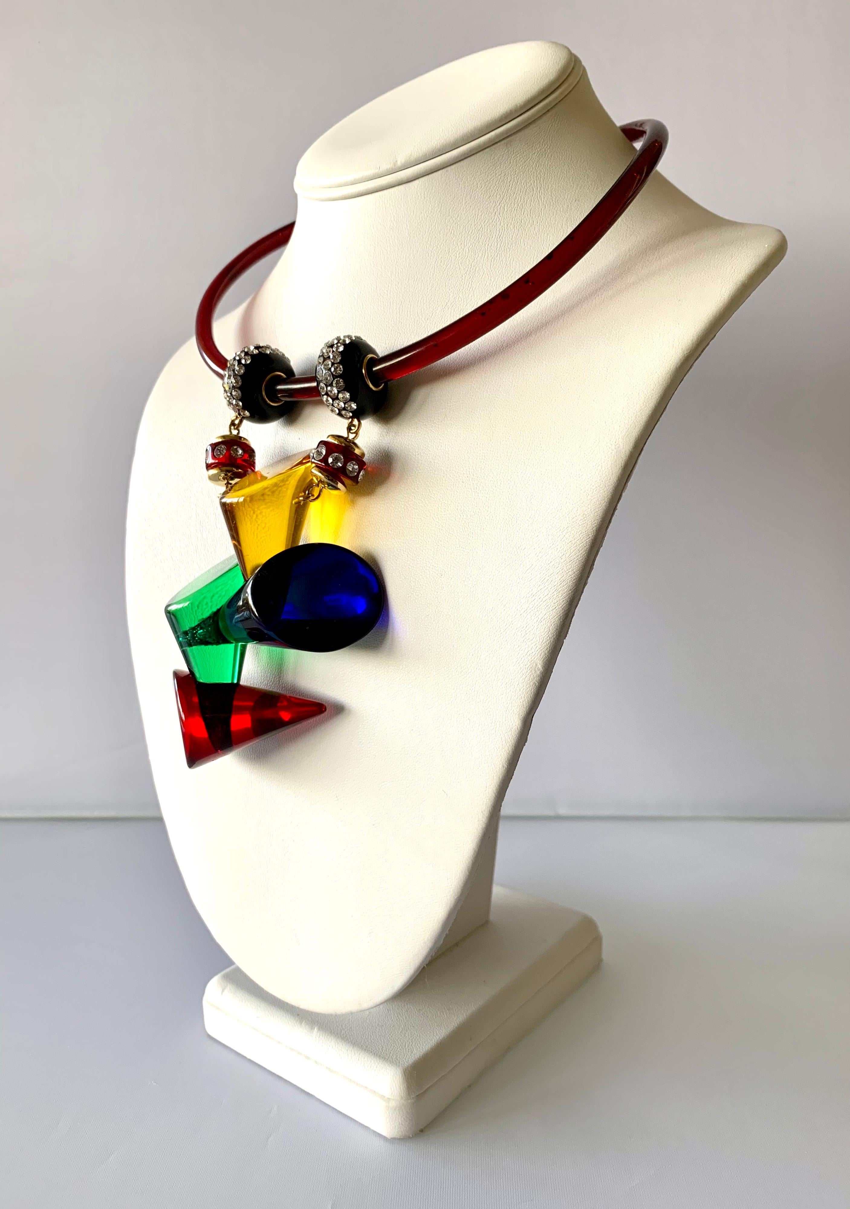 Contemporary Architectural artisan statement pendant necklace - comprised out of blue, green, red, and clear, and yellow acrylic elements the necklace features a large geometric drop at the center adorned with clear rhinestones - made in Paris